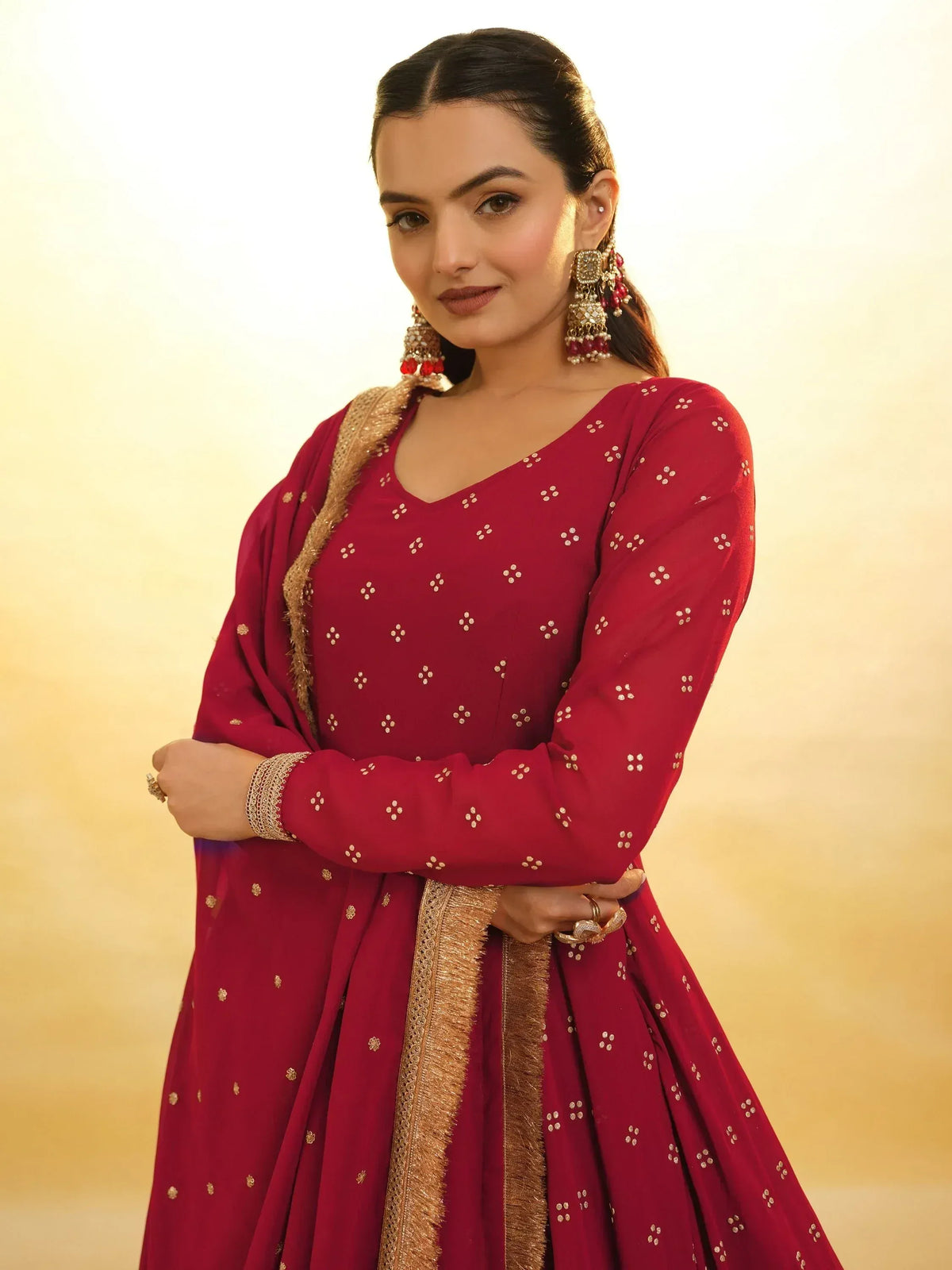 Maroon Indian ethnic anarkali with gold embroidery, perfect for weddings and festive occasions