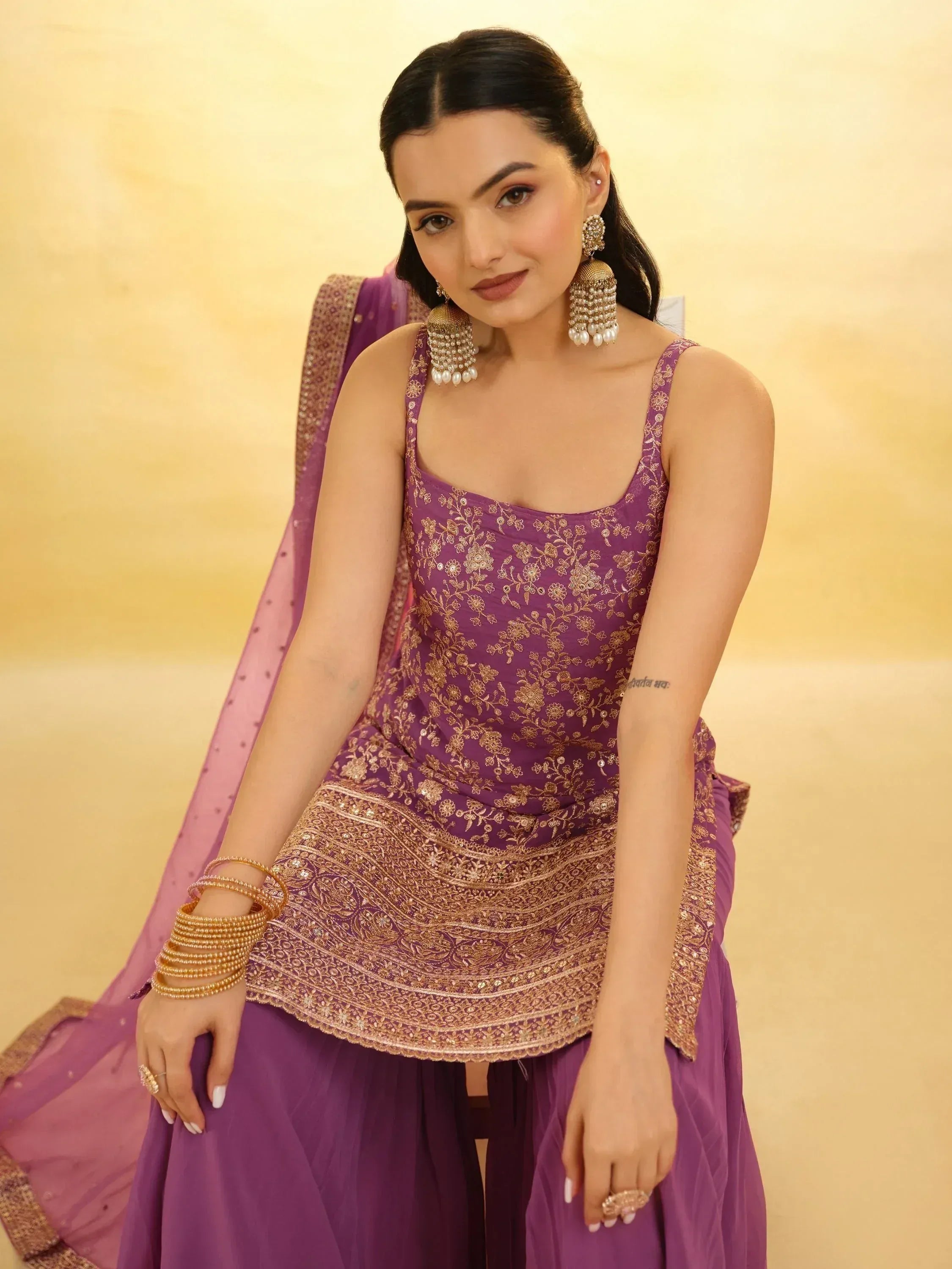 Purple embroidered lehenga choli with gold detailing, perfect for Indian ethnic wear occasions