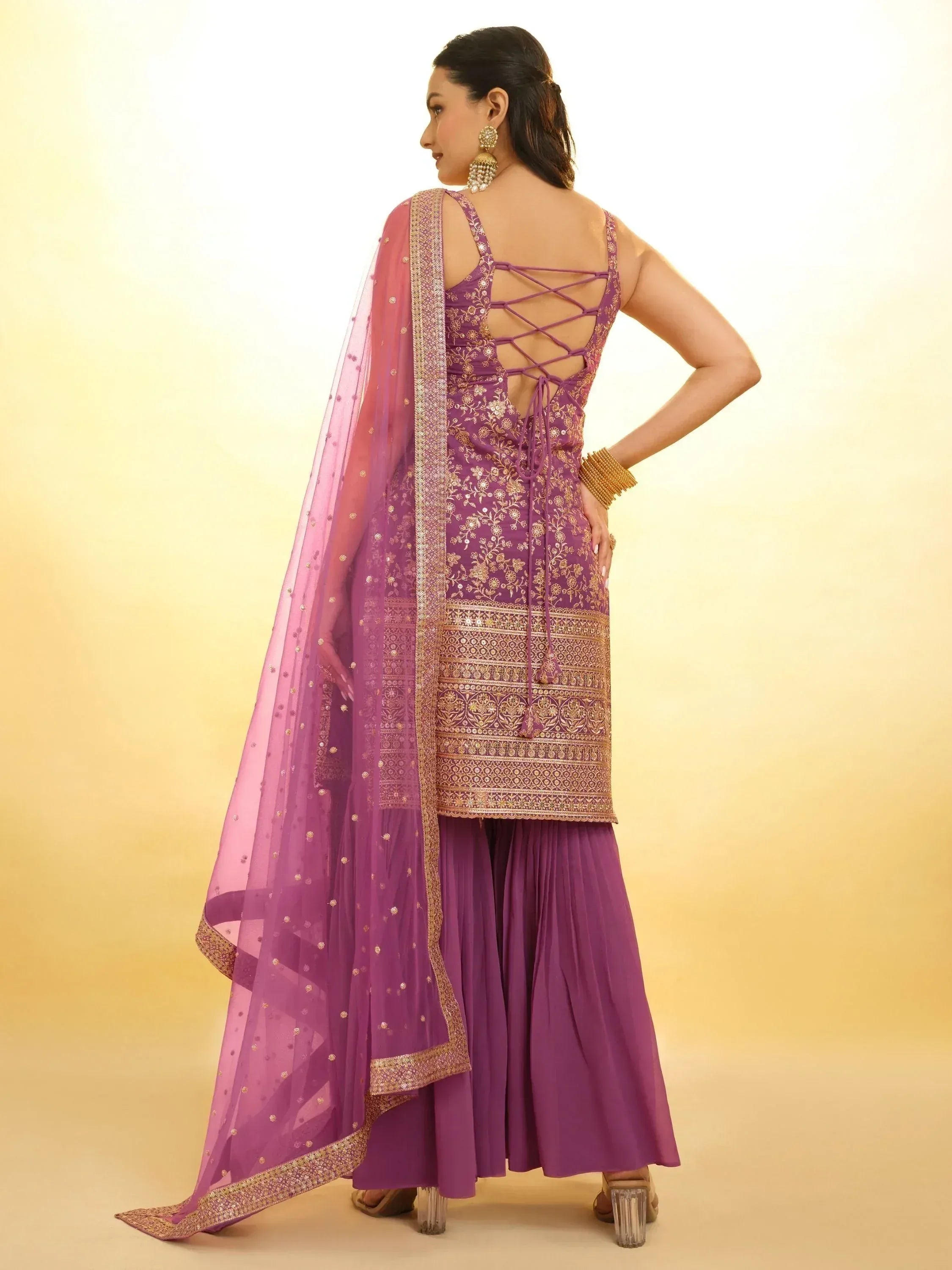 Purple embroidered ethnic gown with crisscross back and matching dupatta, perfect for Indian occasions