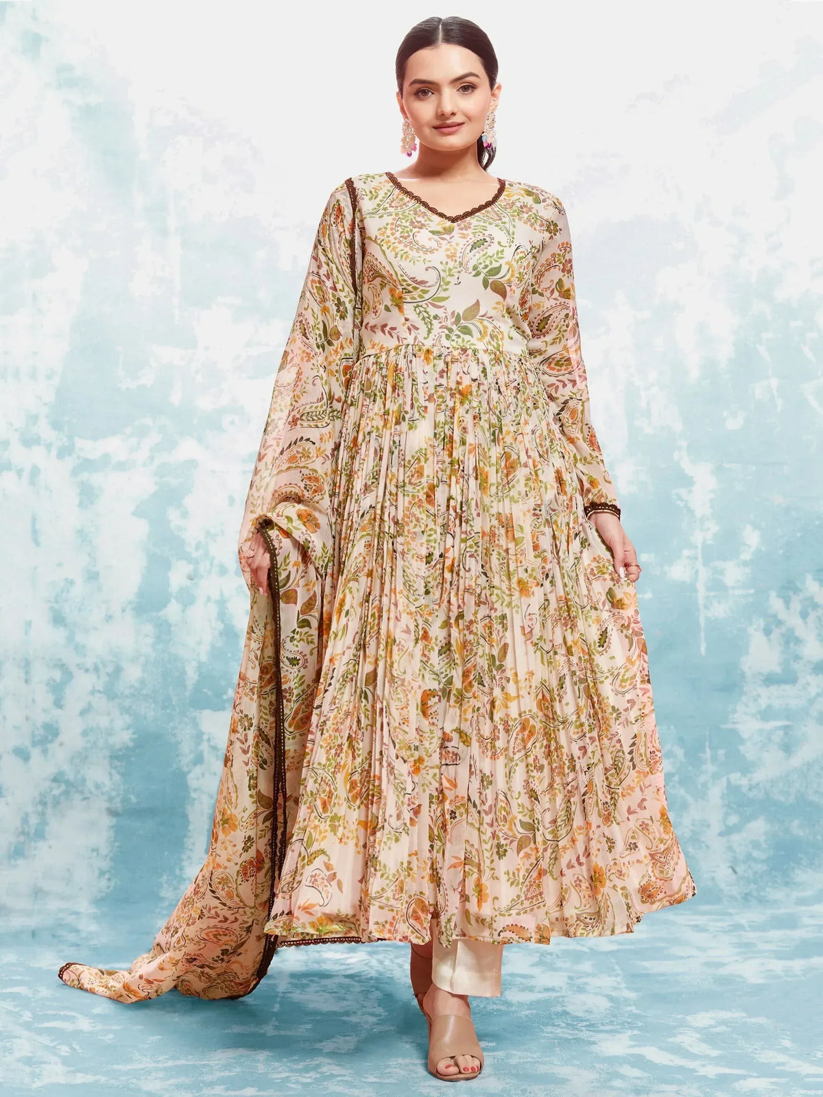 Floral print ethnic gown with pleated skirt and bell sleeves, perfect for Indian occasions