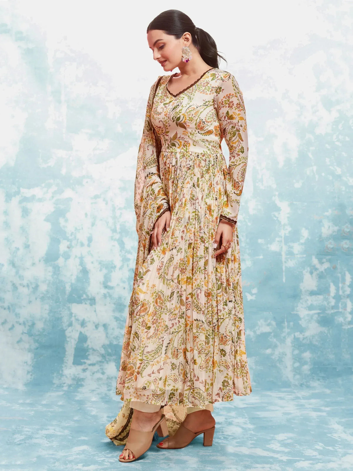 Floral print ethnic gown with pleated skirt and V-neck, perfect for Indian occasions
