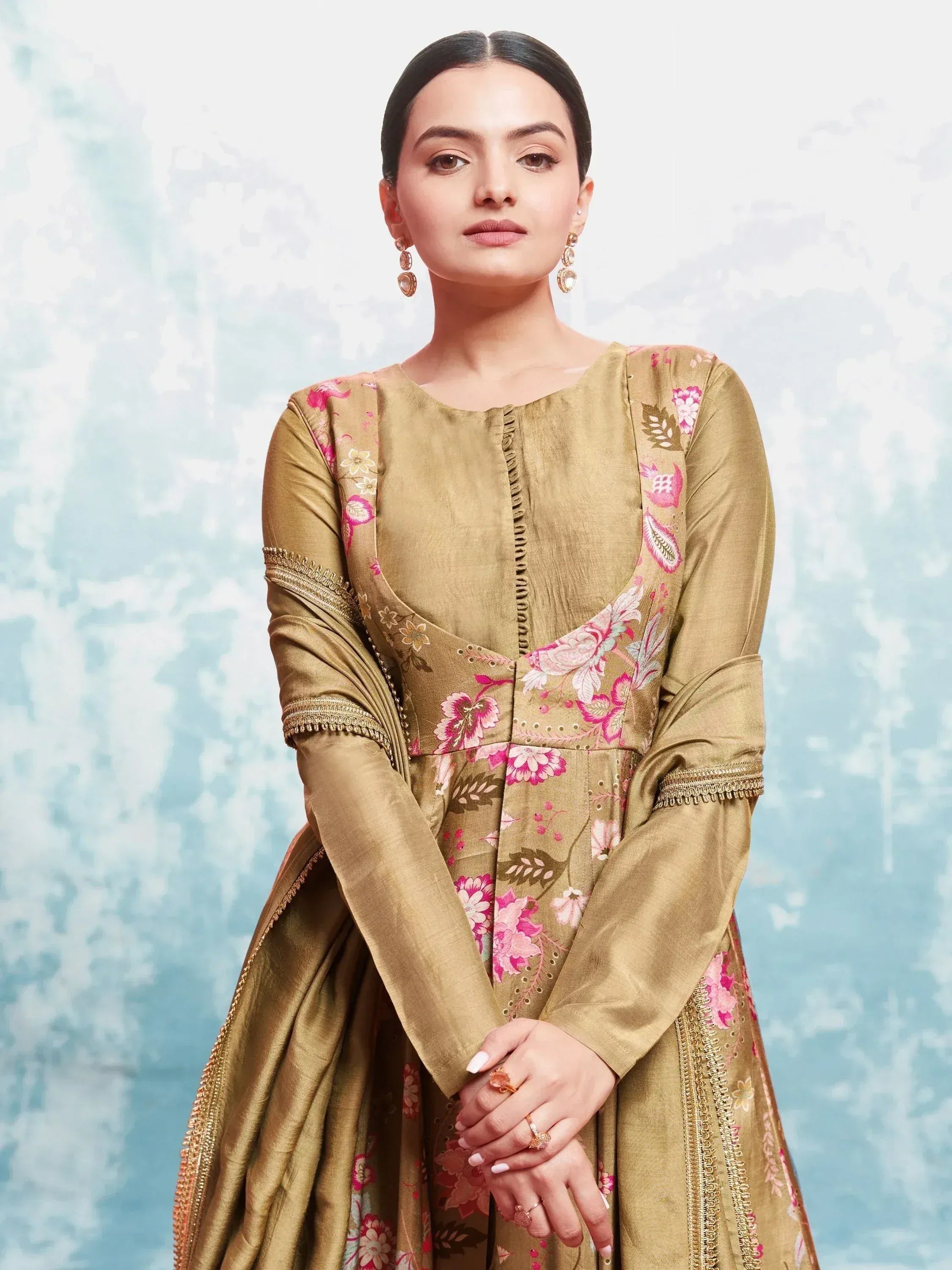 Gold floral embroidered ethnic gown with pink motifs, perfect for Indian occasions and festive wear.