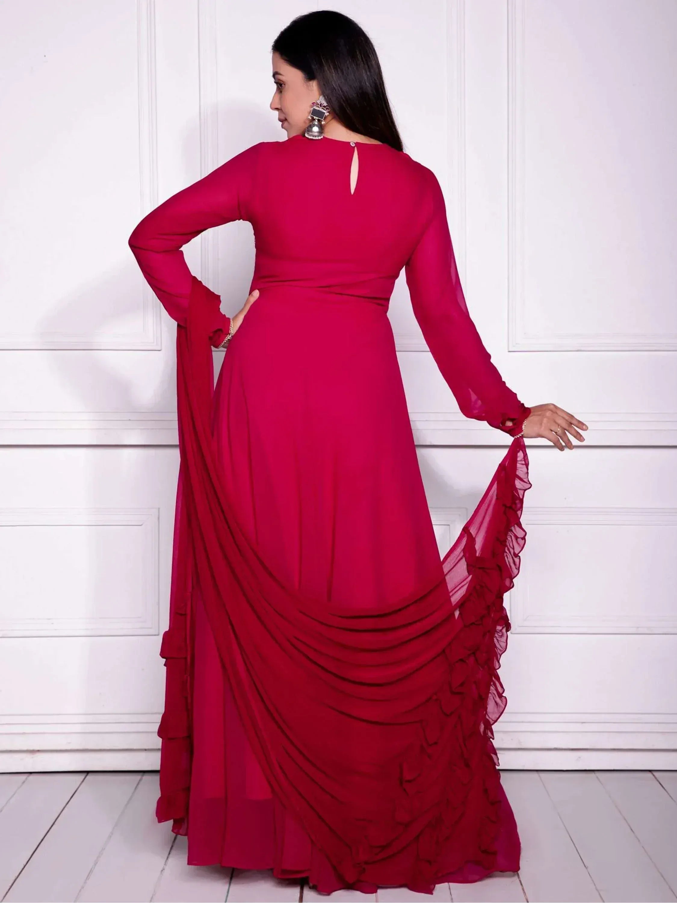 Red ethnic gown with ruffled sleeves and drape, perfect for Indian occasions