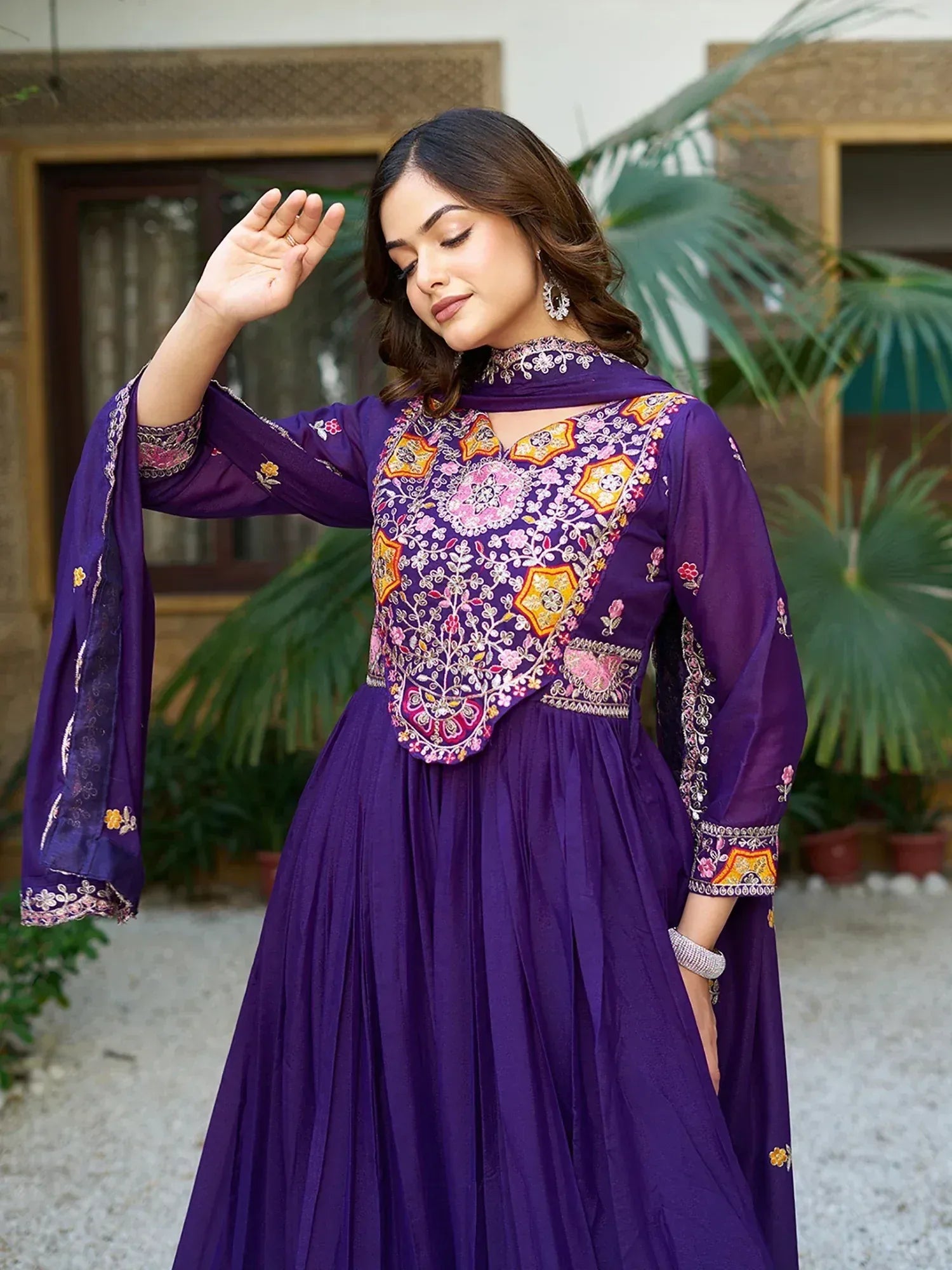 Purple embroidered anarkali gown with floral motifs, perfect for Indian ethnic wear occasions