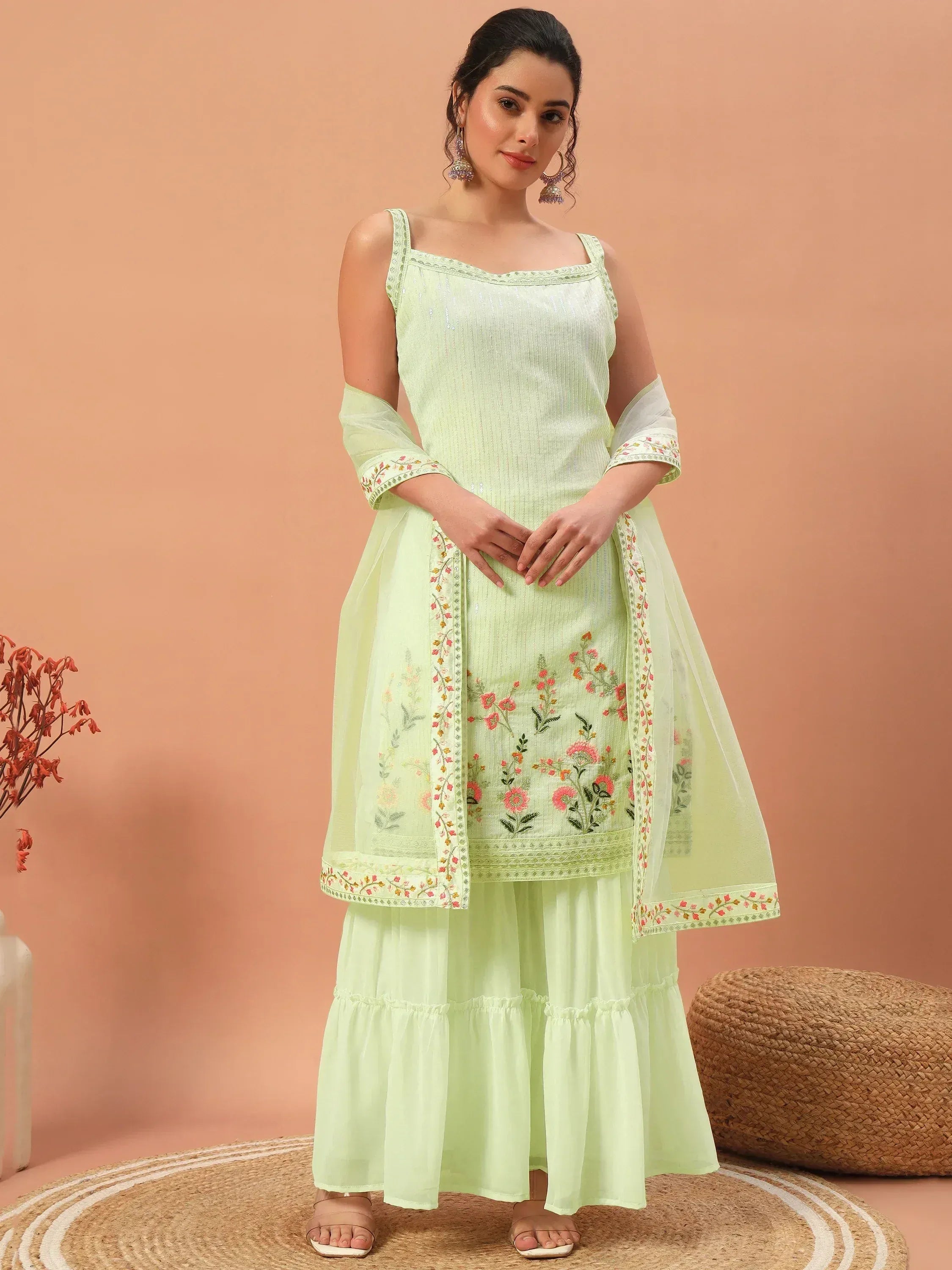 Light green embroidered ethnic kurta with flared palazzo and dupatta, perfect for festive occasions