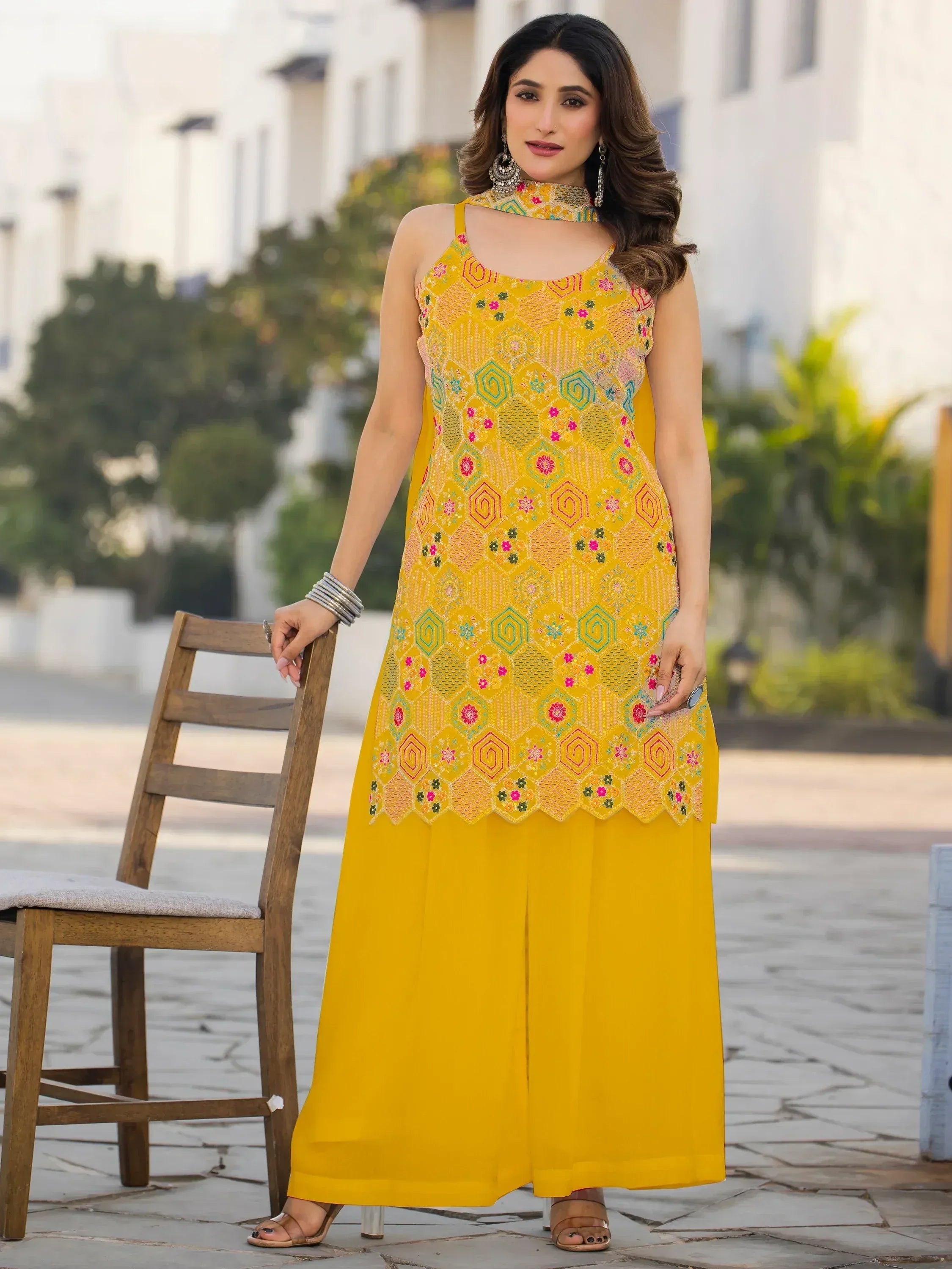 Yellow embroidered ethnic gown with matching palazzo pants, perfect for Indian festive wear