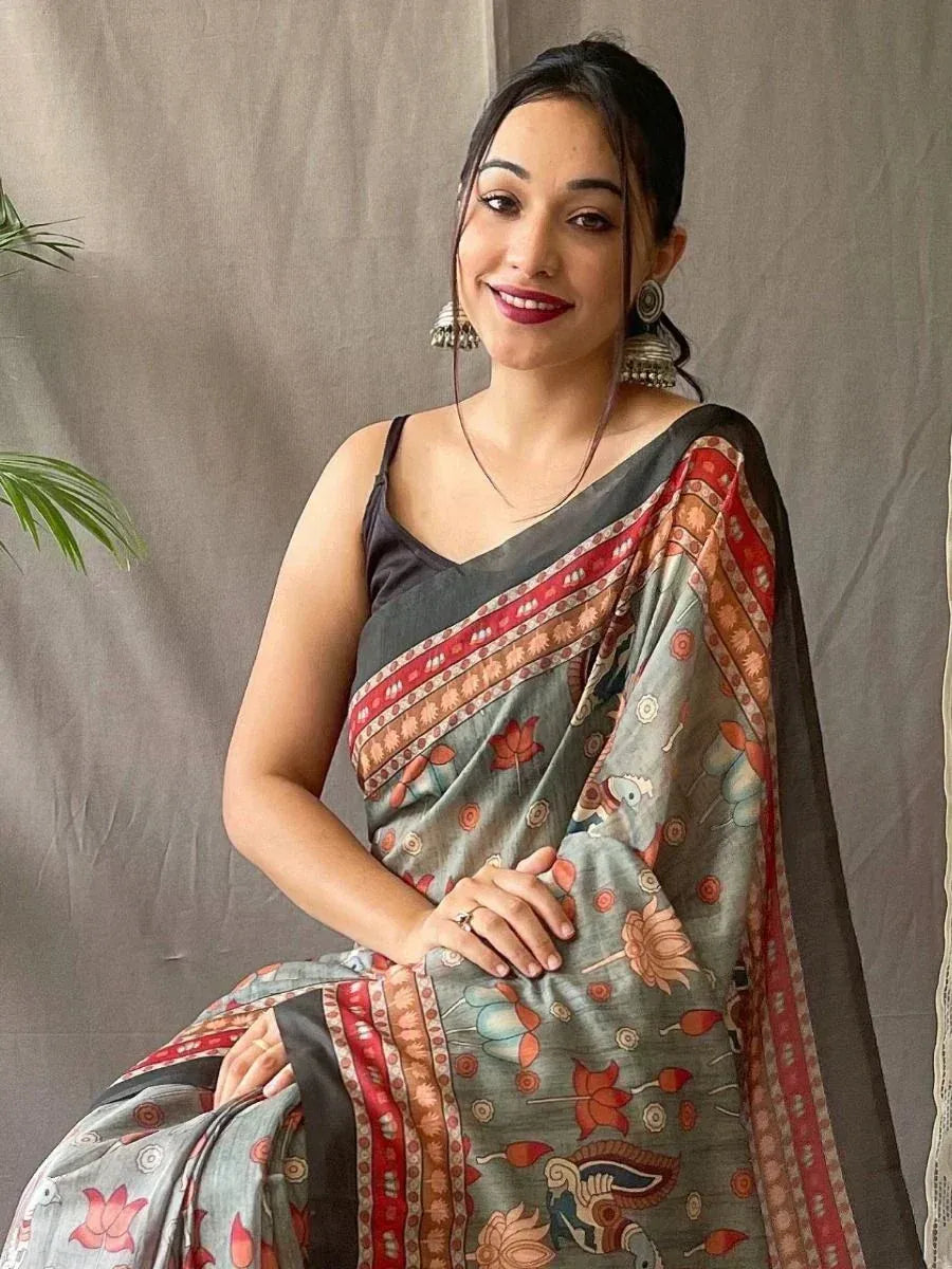 Woman in grey floral saree with red border, ethnic Indian wear, designer saree style