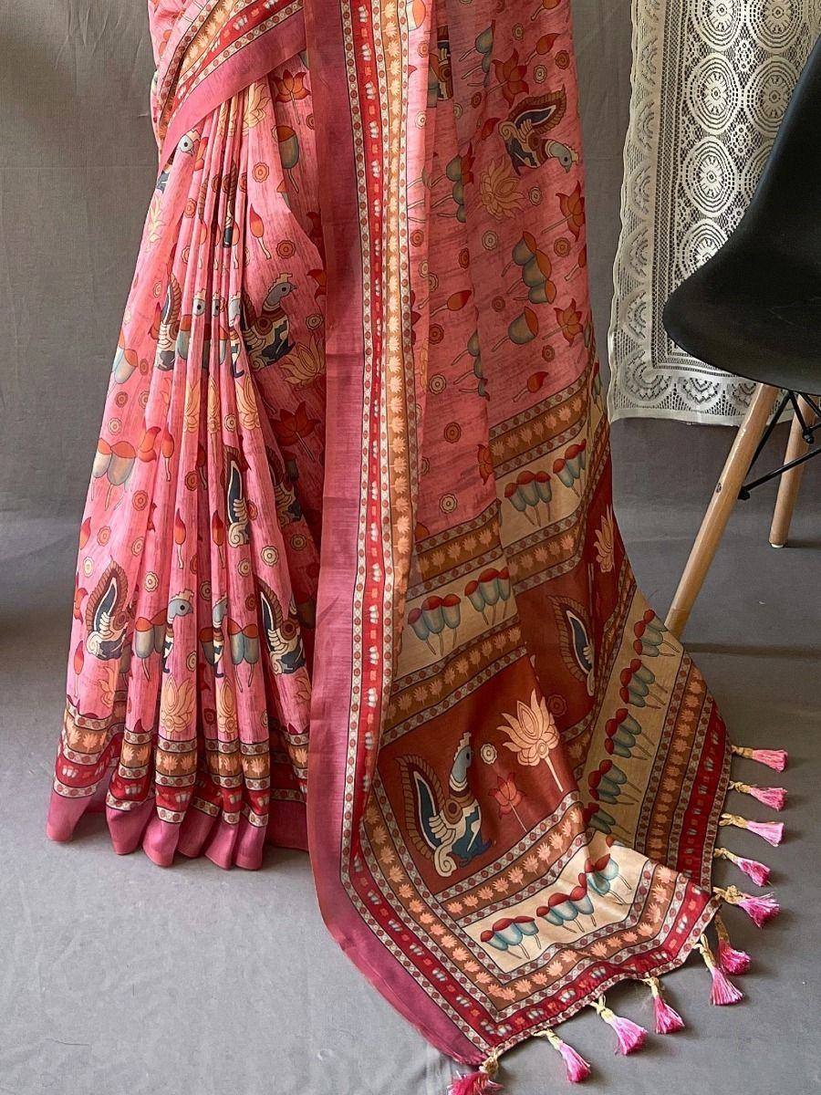 Pink printed saree with peacock motifs, tassels, and ethnic border design for traditional Indian wear