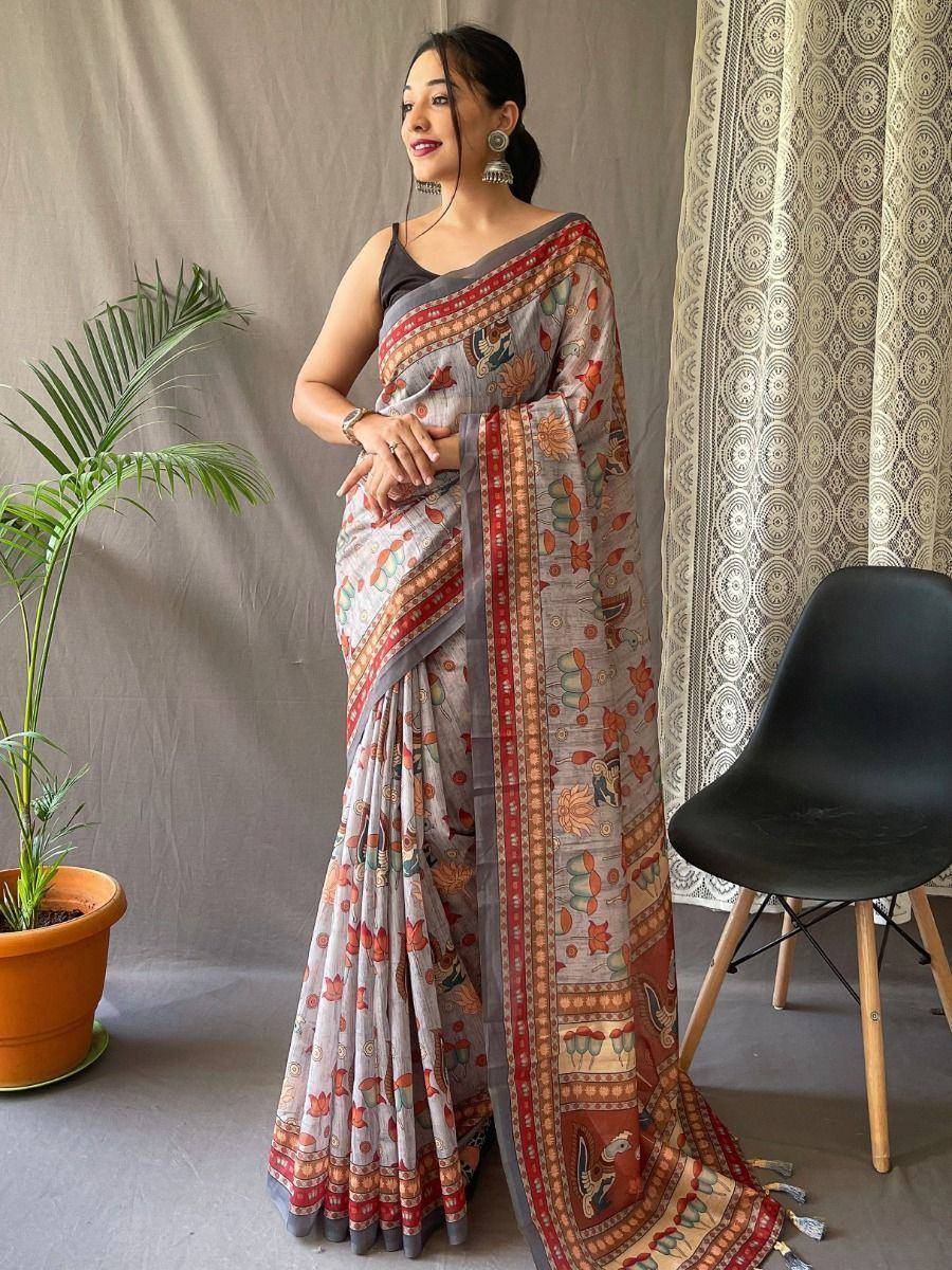 Elegant printed saree with floral motifs and border, paired with black blouse for Indian ethnic wear