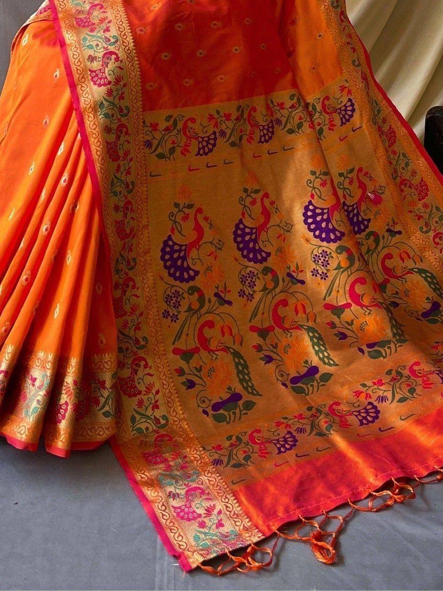 Vibrant orange saree with peacock and floral print, perfect for Indian ethnic wear occasions