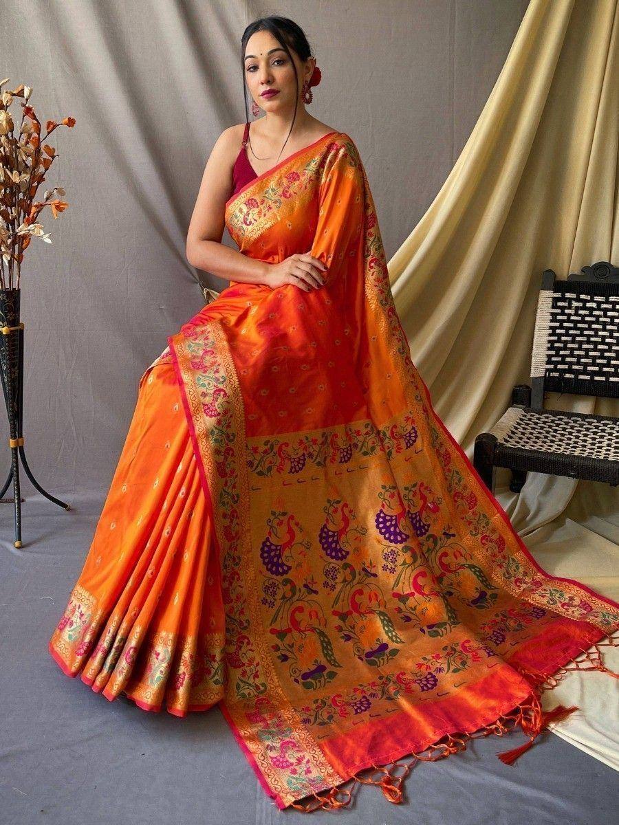 Orange designer saree with peacock print, perfect for ethnic occasions and festive wear.