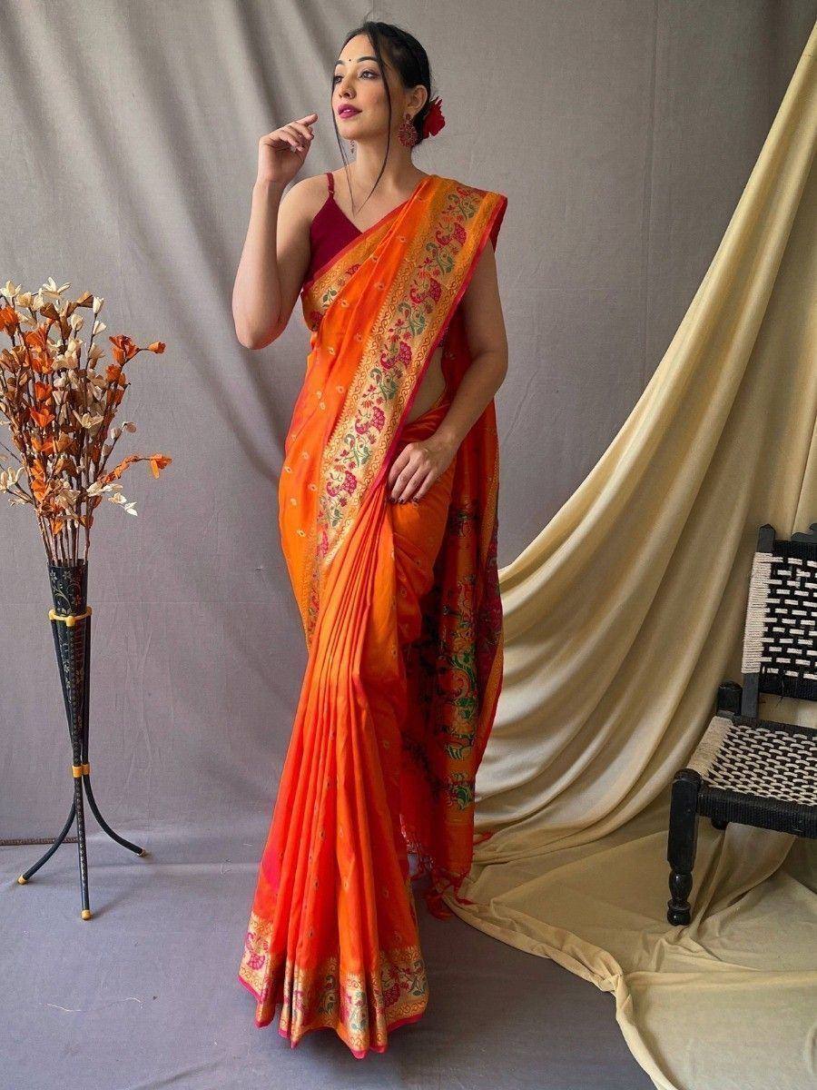Orange floral saree with gold border, styled with maroon blouse for ethnic wear