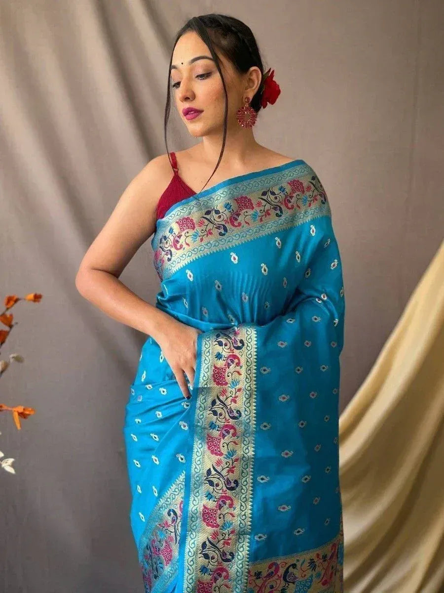 Blue embroidered saree with floral border, paired with red blouse, ideal for Indian ethnic occasions