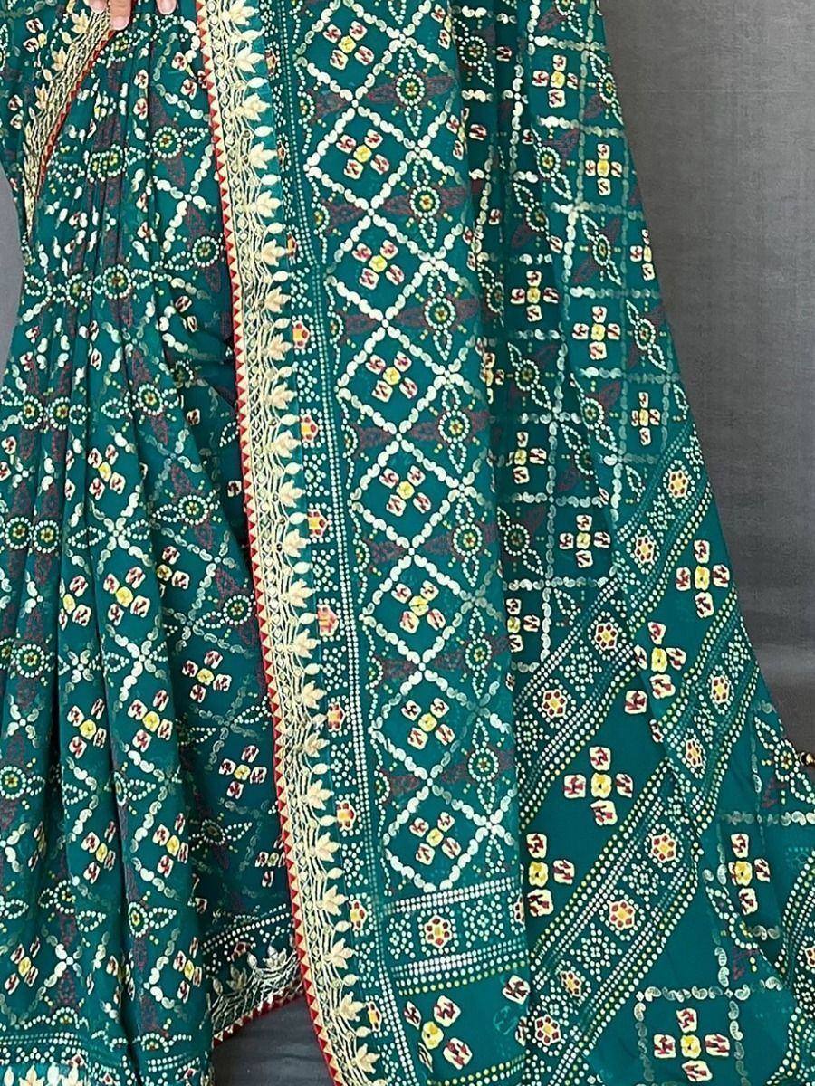 Teal green ethnic printed dress with intricate geometric and floral patterns, perfect for Indian occasions.