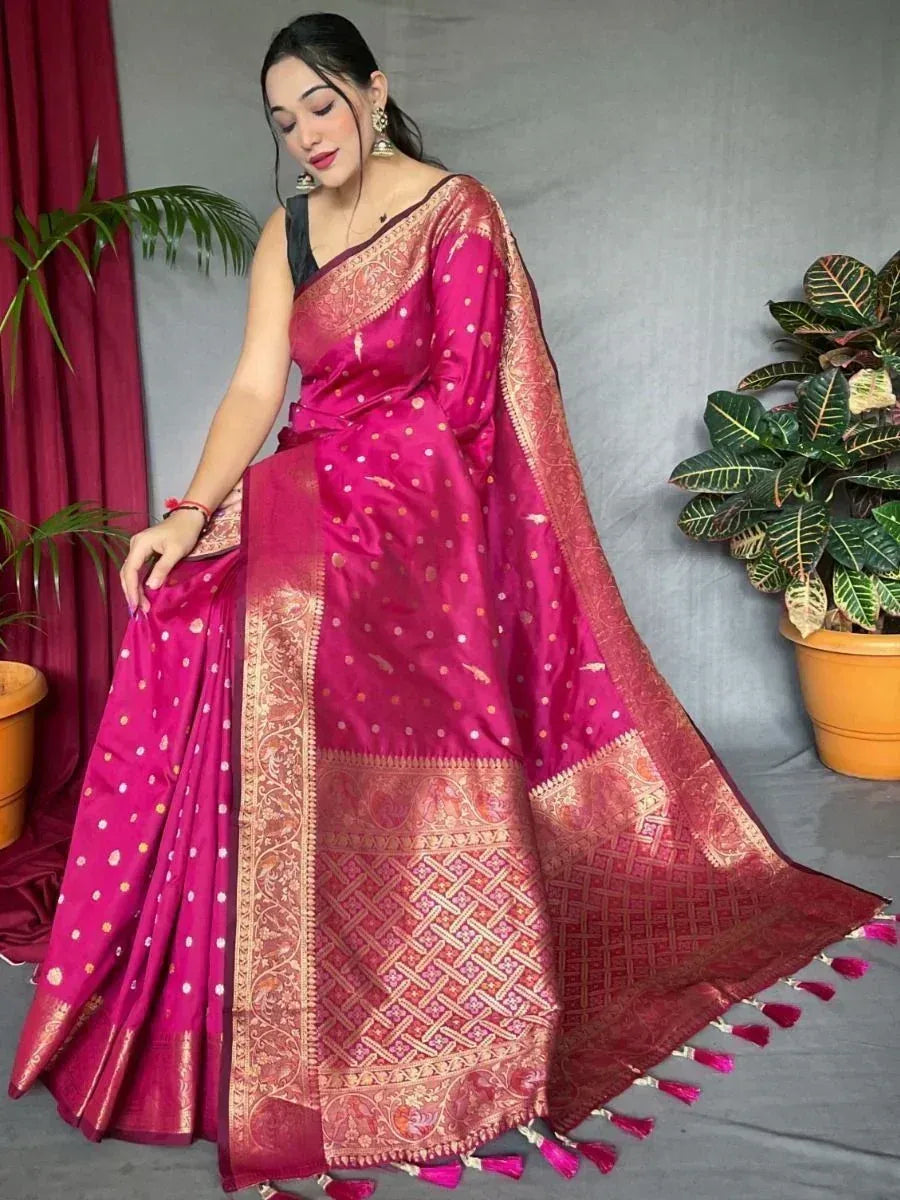 Pink silk saree with gold zari border and tassels, perfect for Indian ethnic occasions