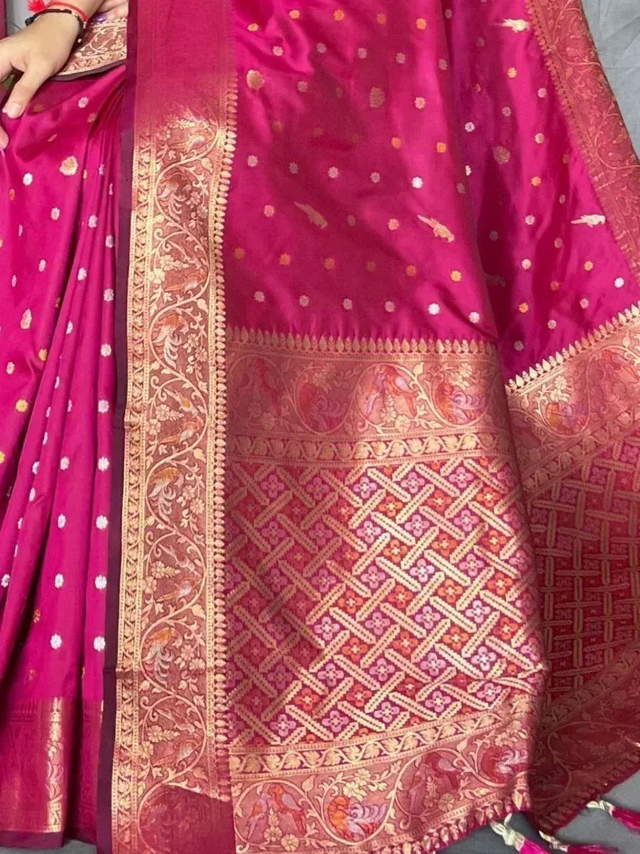 Rich pink ethnic saree with gold floral border and intricate woven patterns, perfect for Indian occasions