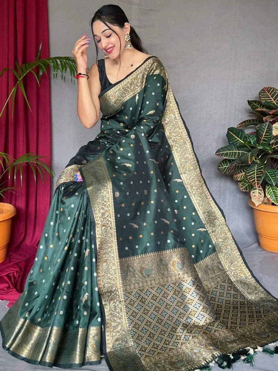 Elegant green silk saree with gold zari border and polka dot print, perfect for Indian ethnic occasions