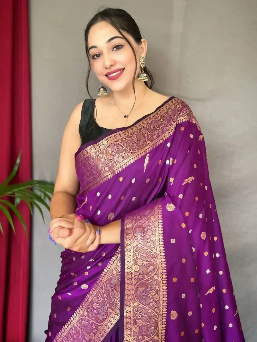 Purple designer saree with gold embroidery and bird motifs, paired with black blouse for ethnic wear