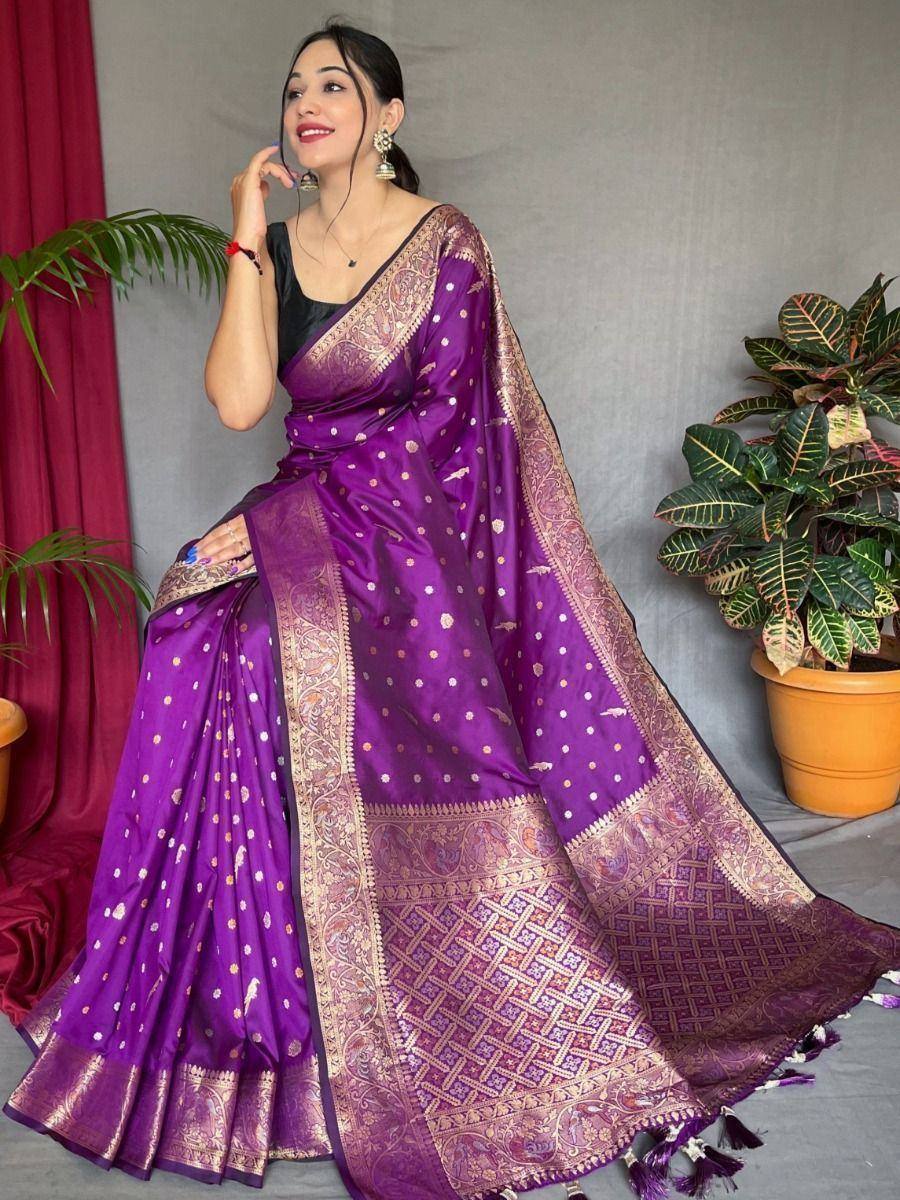 Purple designer saree with gold zari work and intricate border, perfect for ethnic occasions