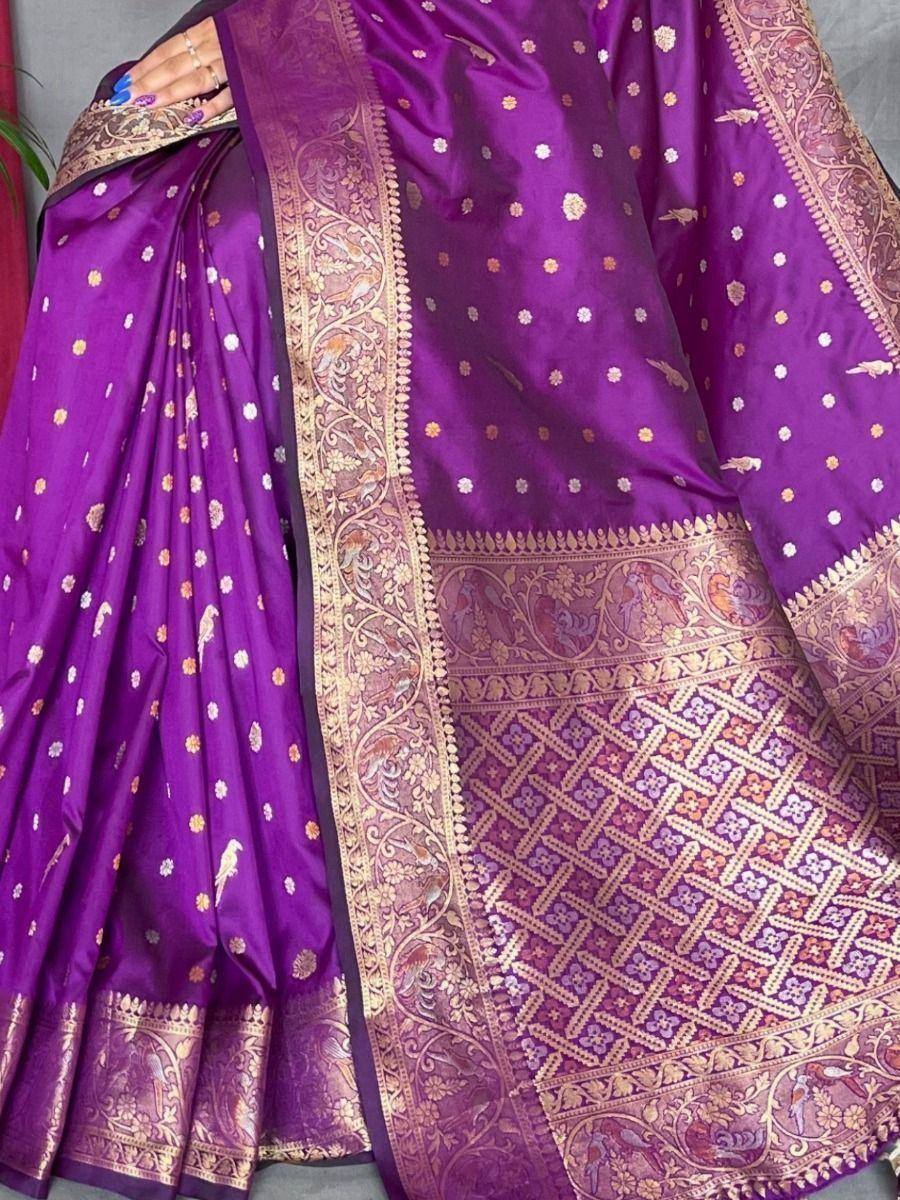 Purple silk saree with gold floral and bird motifs, intricate border design, ethnic wear