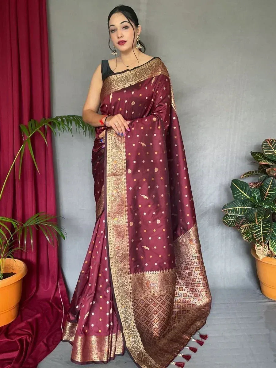 Maroon silk saree with gold zari border and polka dots, styled with black blouse for ethnic occasions
