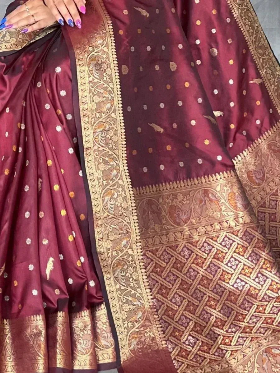 Maroon silk saree with gold zari border and floral motifs, elegant Indian ethnic wear
