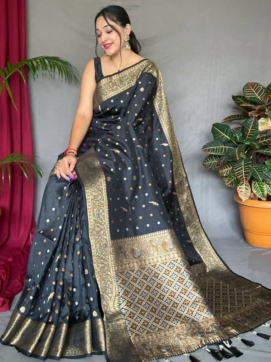 Black and gold designer saree with intricate embroidery and border, perfect for ethnic occasions