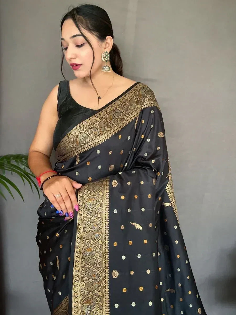 Black saree with gold floral embroidery and intricate border, paired with matching blouse for ethnic wear