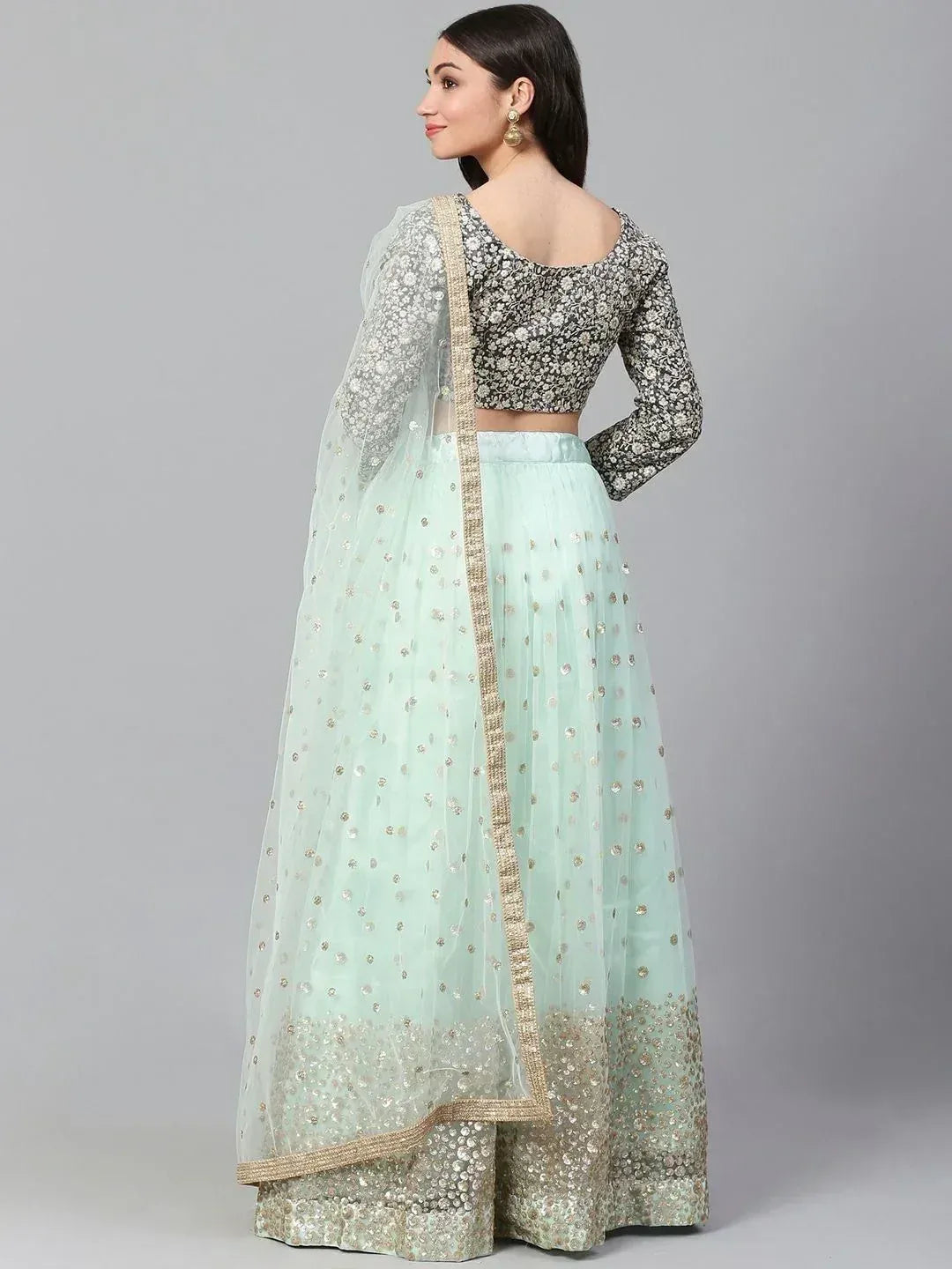 Mint green lehenga choli with floral blouse and gold embellishments, perfect for Indian ethnic wear