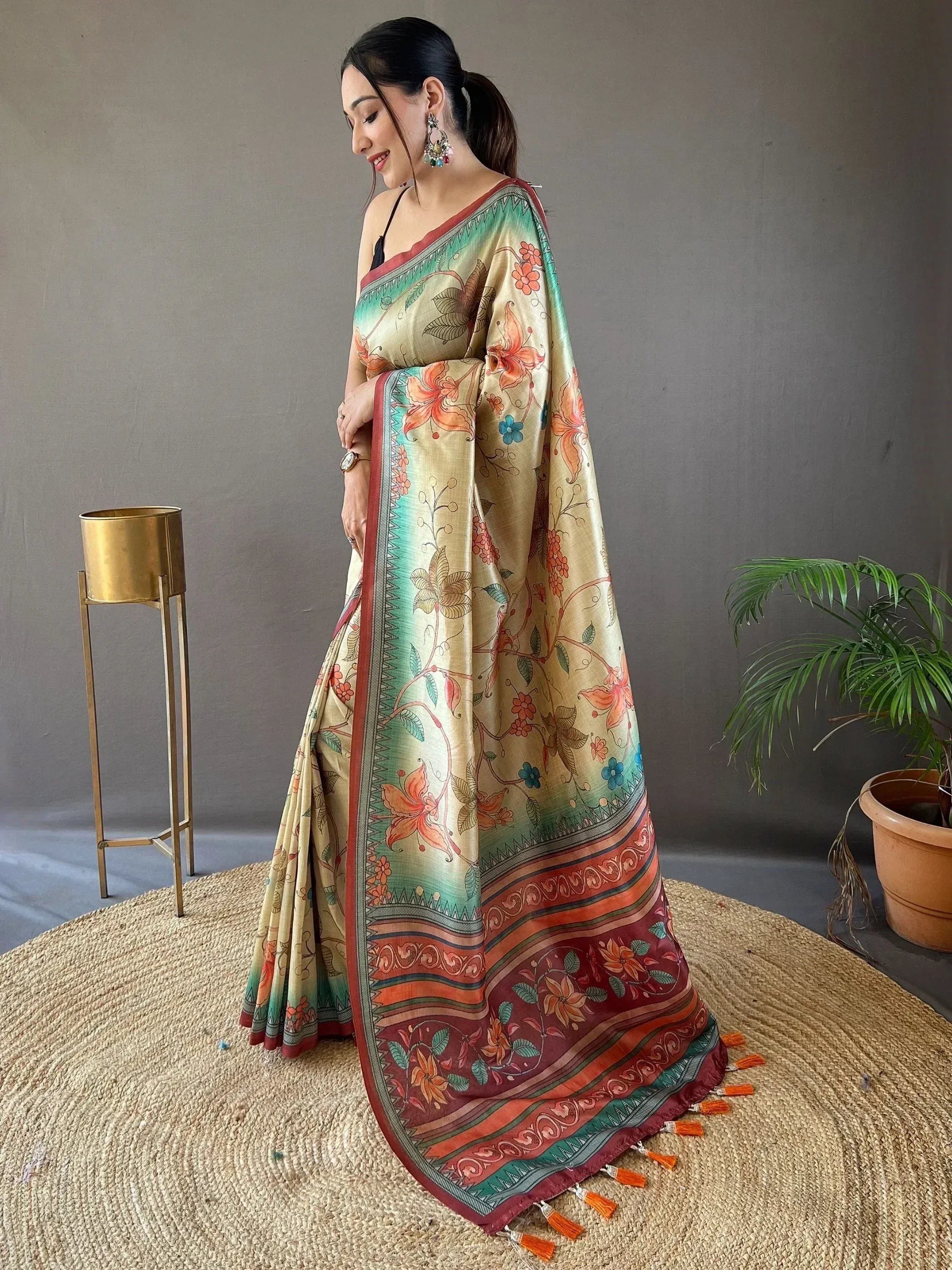 Woman in floral printed saree with tassels, ethnic Indian wear for festive occasions