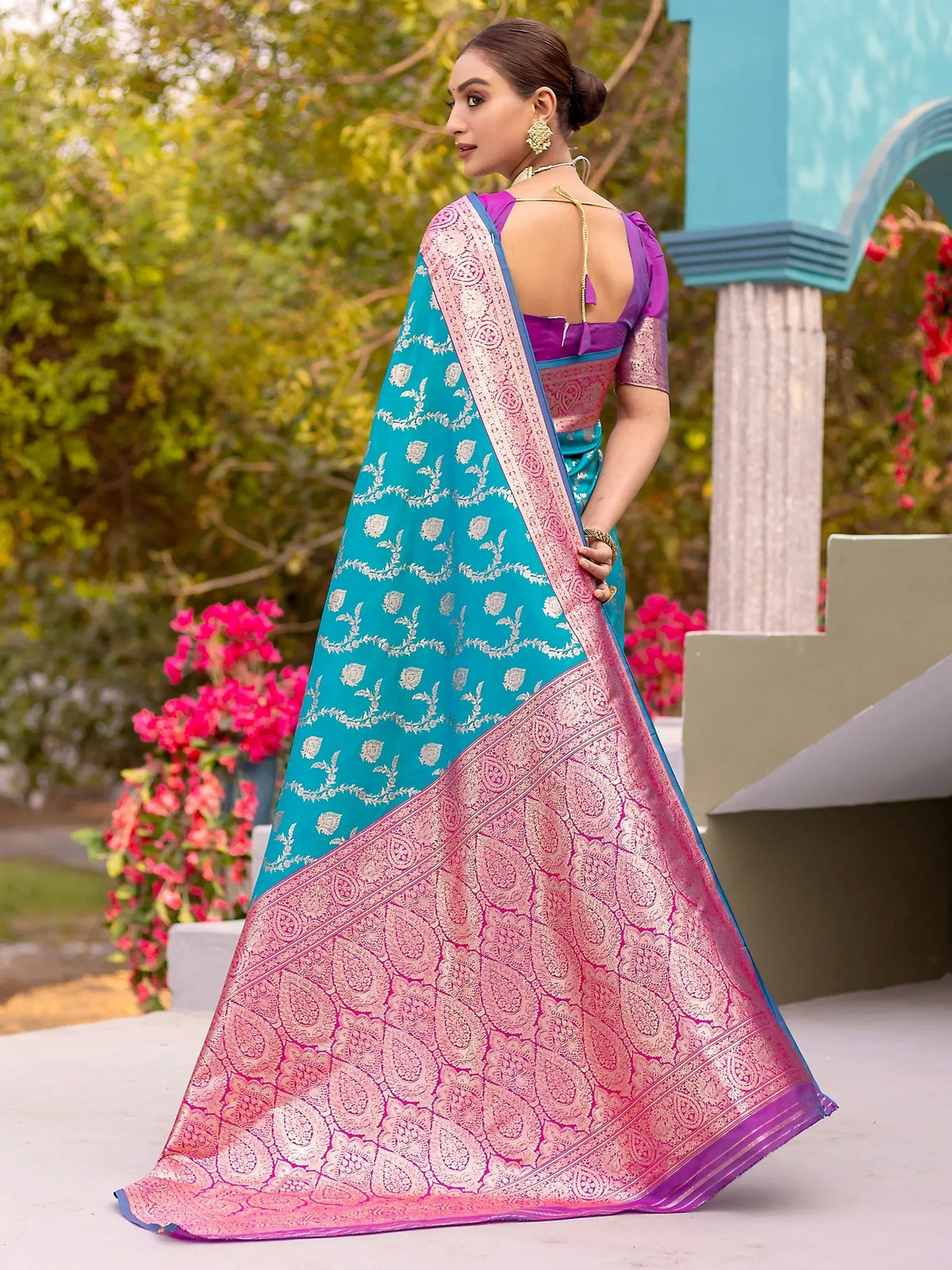 Elegant turquoise and pink saree with intricate gold embroidery, perfect for Indian ethnic wear.