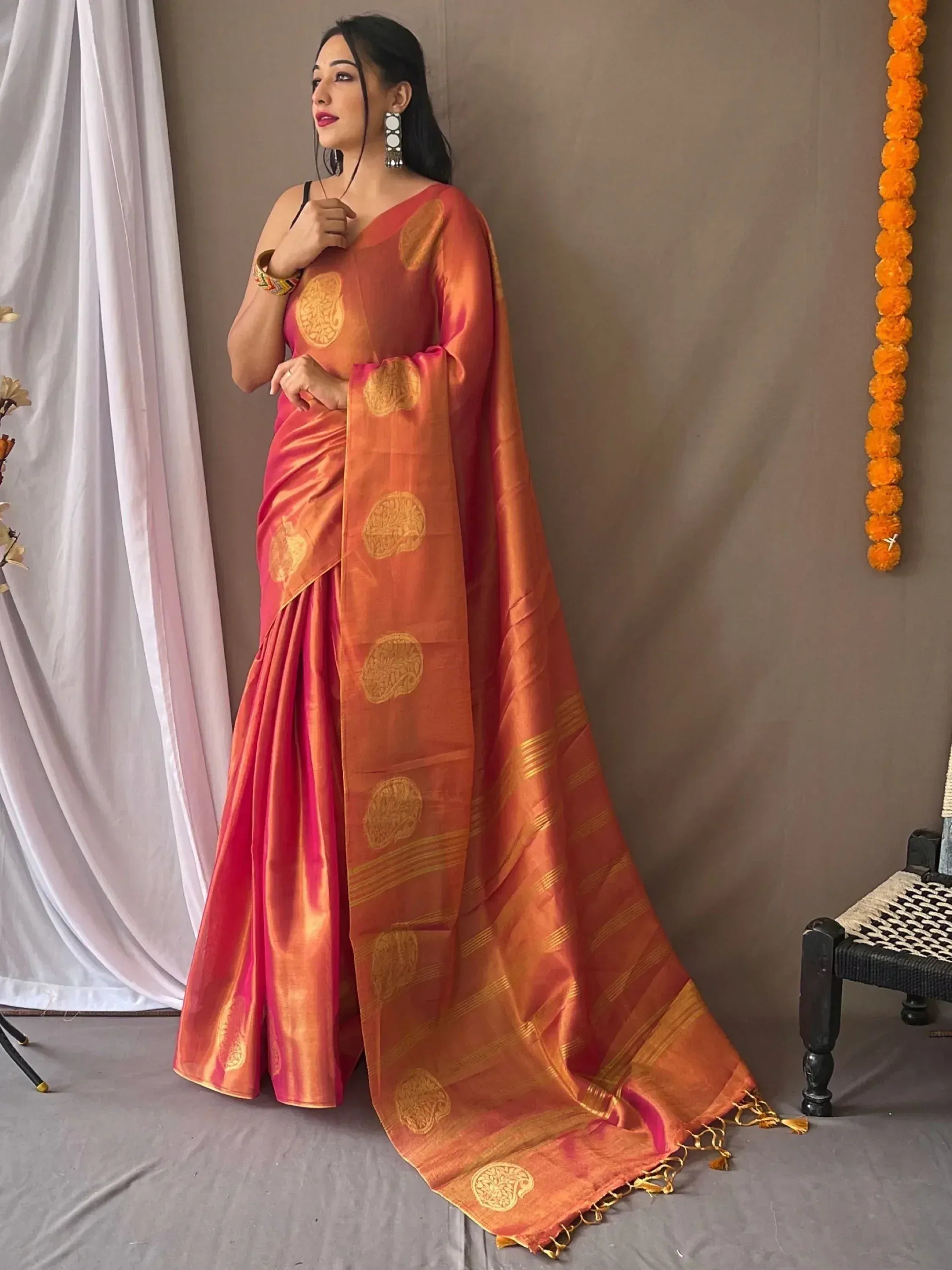 Orange and pink silk saree with gold paisley motifs, perfect for Indian ethnic wear occasions