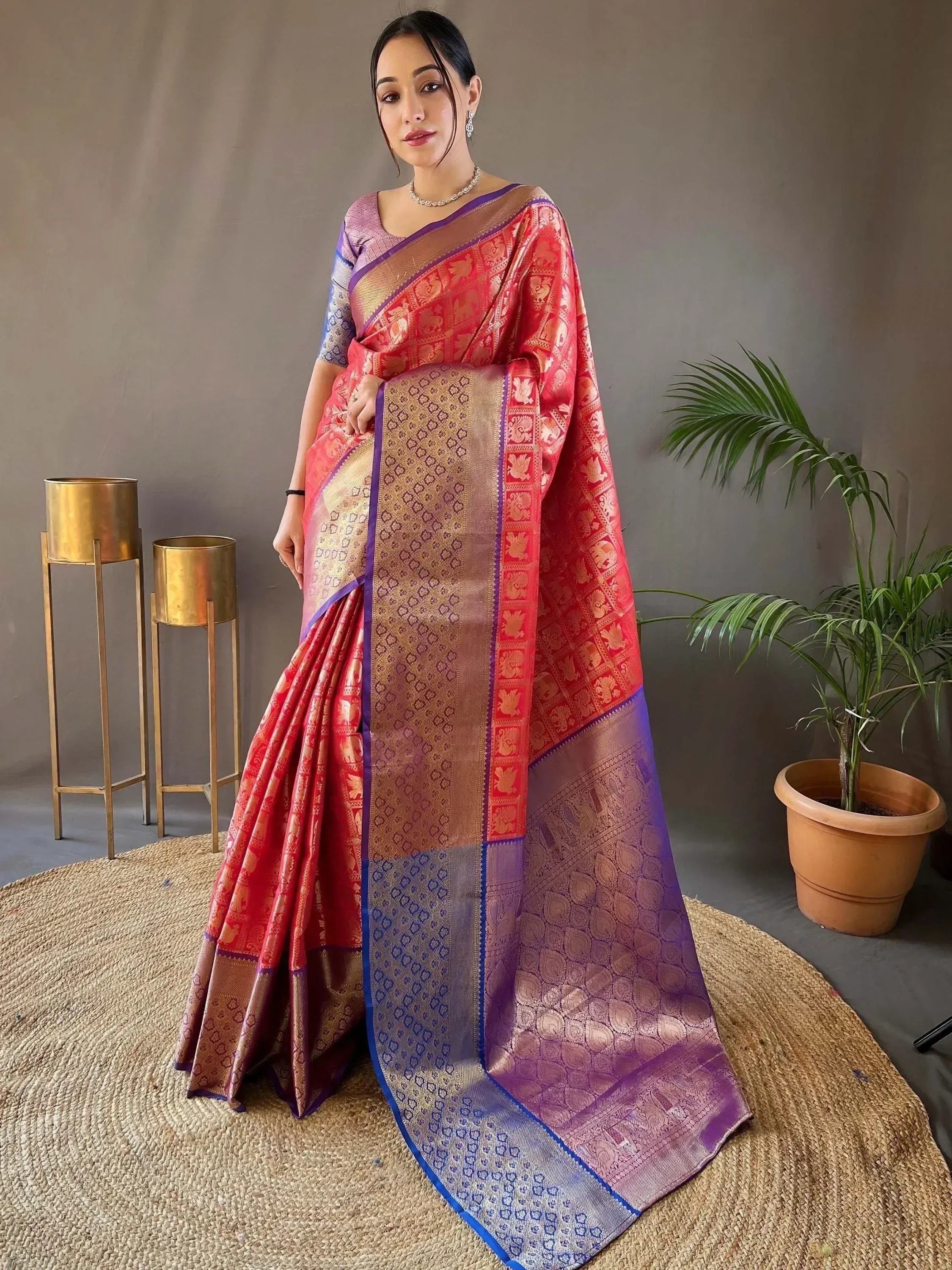 Red and purple designer saree with gold elephant motifs and woven border, styled for Indian ethnic wear