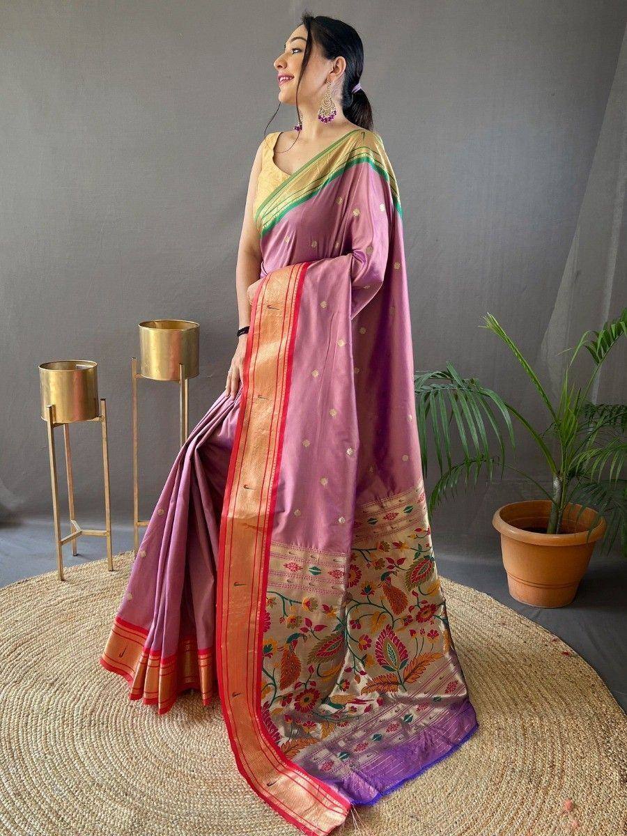 Elegant purple silk saree with floral border and gold zari, paired with yellow blouse, perfect for Indian ethnic occasions.