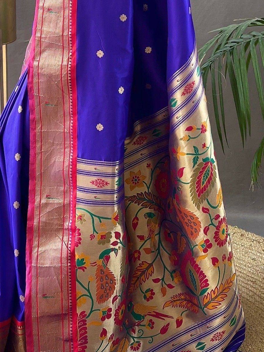 Vibrant purple saree with floral peacock embroidery, gold border, and pink trim for ethnic wear