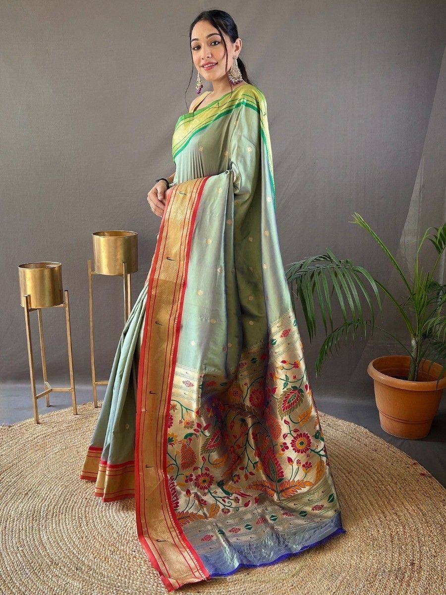 Elegant green saree with floral embroidery and gold border, styled for Indian ethnic wear occasions