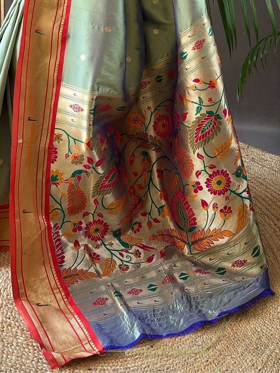 Elegant Indian saree with floral and bird motifs, gold border, and vibrant colors for ethnic wear