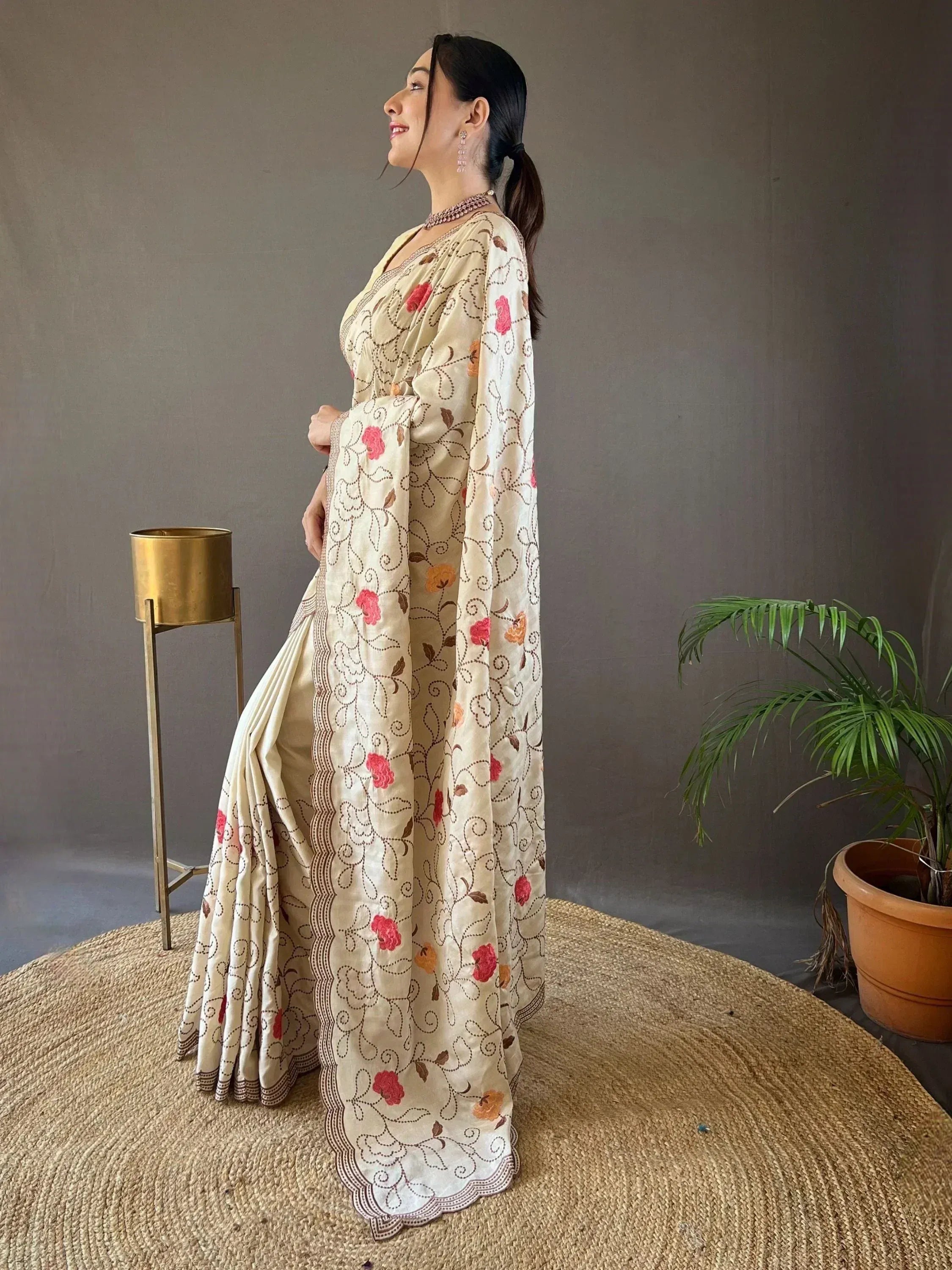 Cream saree with floral embroidery, perfect for Indian ethnic wear and designer occasions