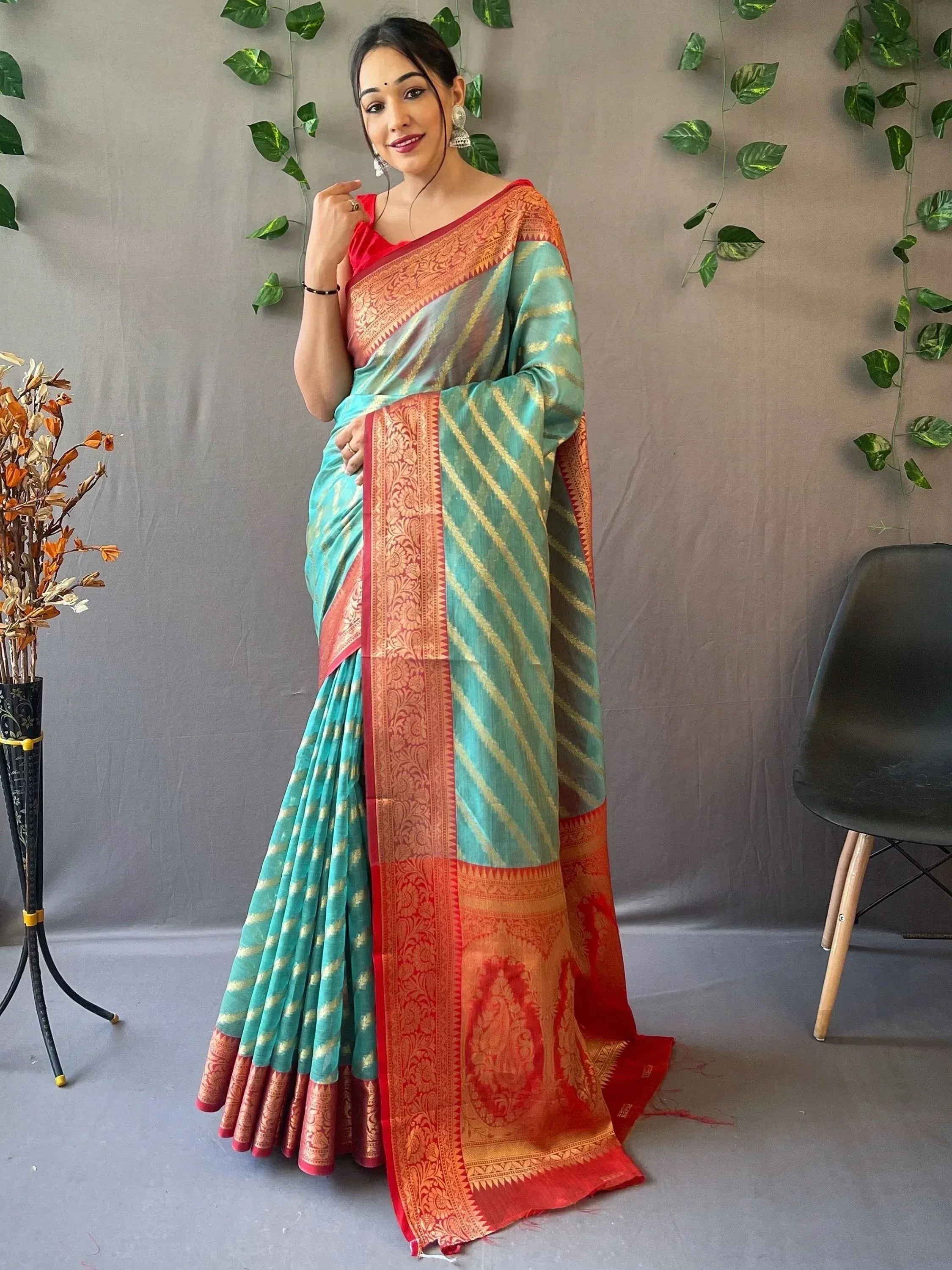 Turquoise and red designer saree with gold stripes and intricate border, perfect for ethnic occasions