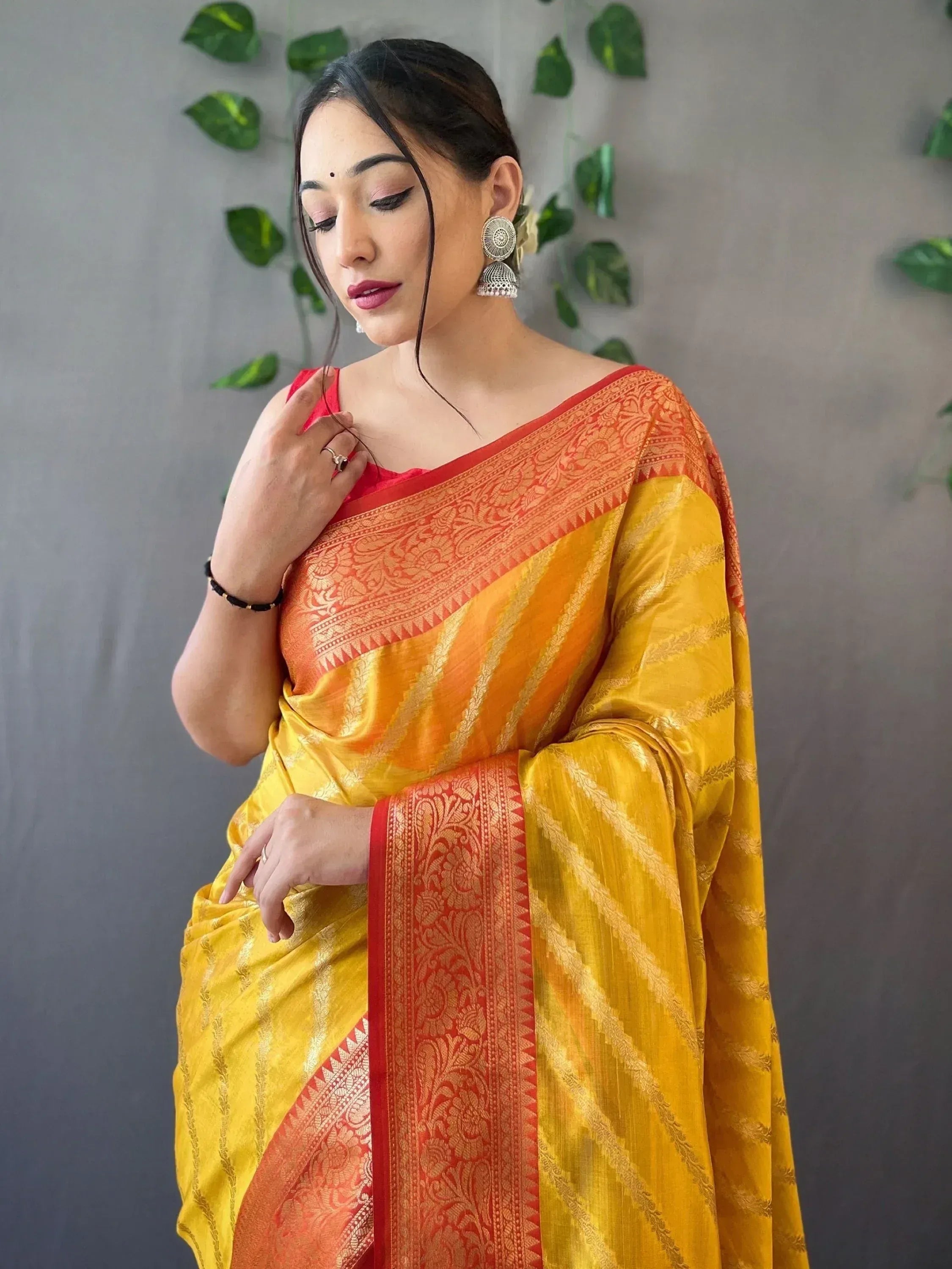 Yellow and red ethnic saree with gold zari work, perfect for Indian occasions and festivals