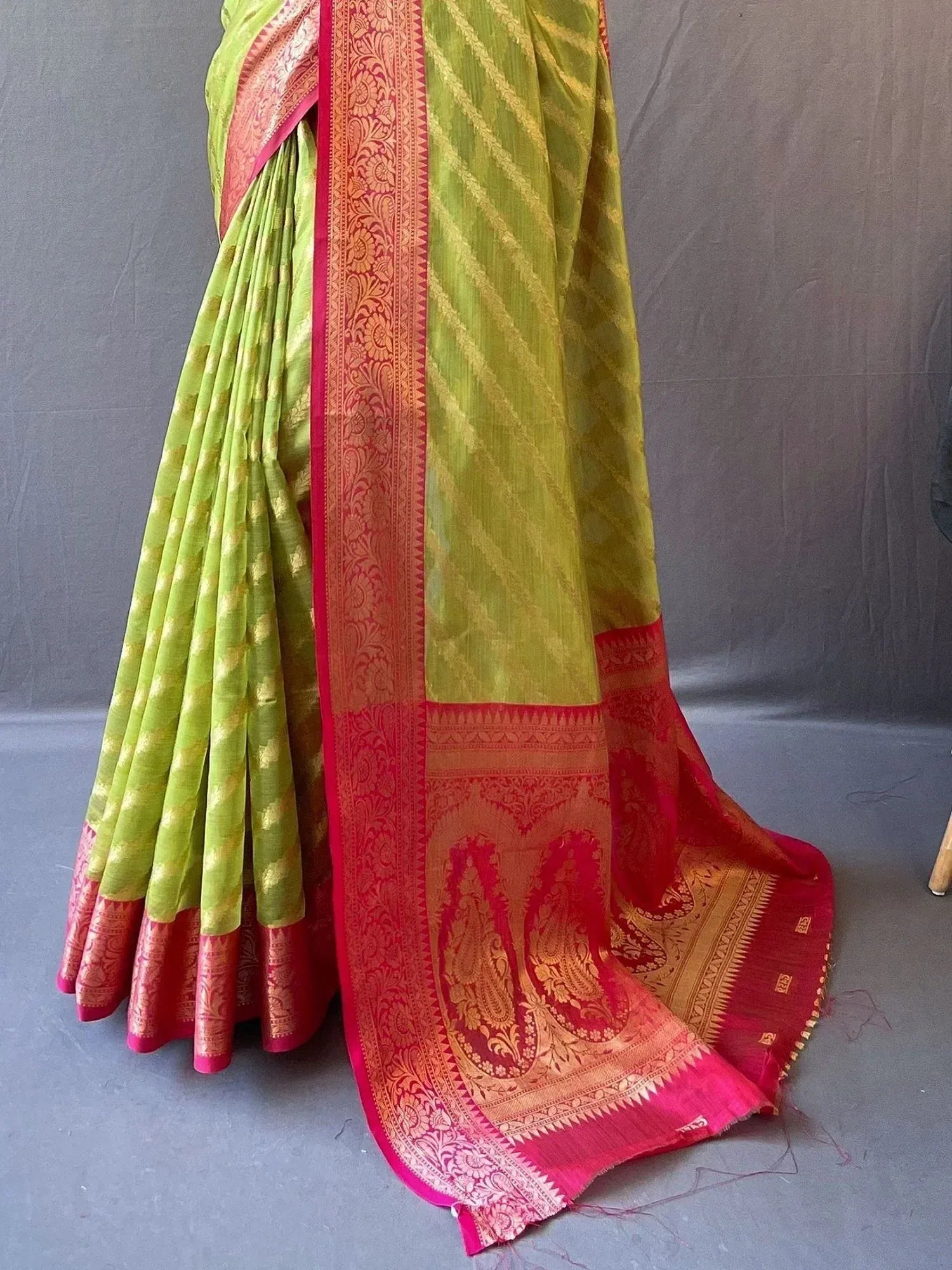 Lime green saree with red gold border, paisley motifs, ethnic Indian wear