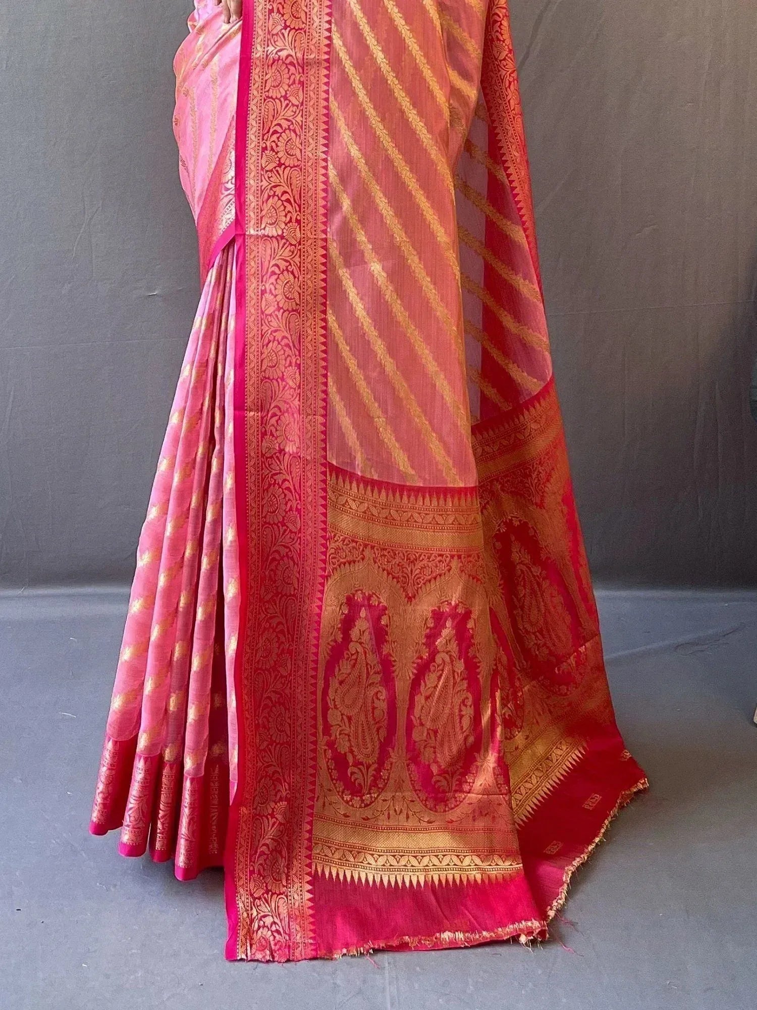 Pink and gold designer saree with intricate paisley border, perfect for Indian ethnic wear occasions