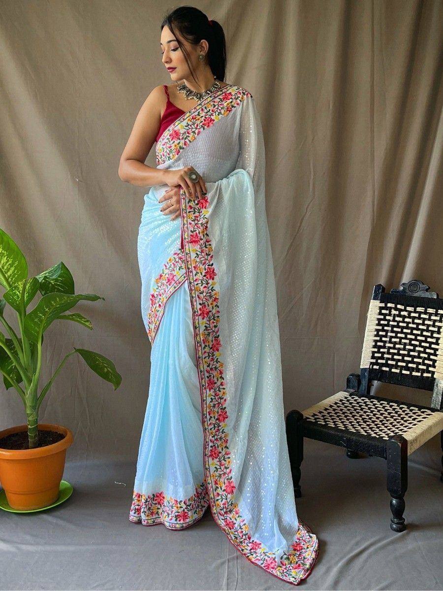 Light blue floral embroidered saree with red blouse, perfect for Indian ethnic occasions