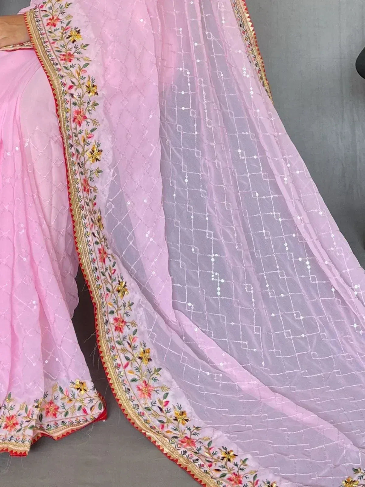 Pink ethnic saree with floral embroidery and sequin work, perfect for Indian occasions