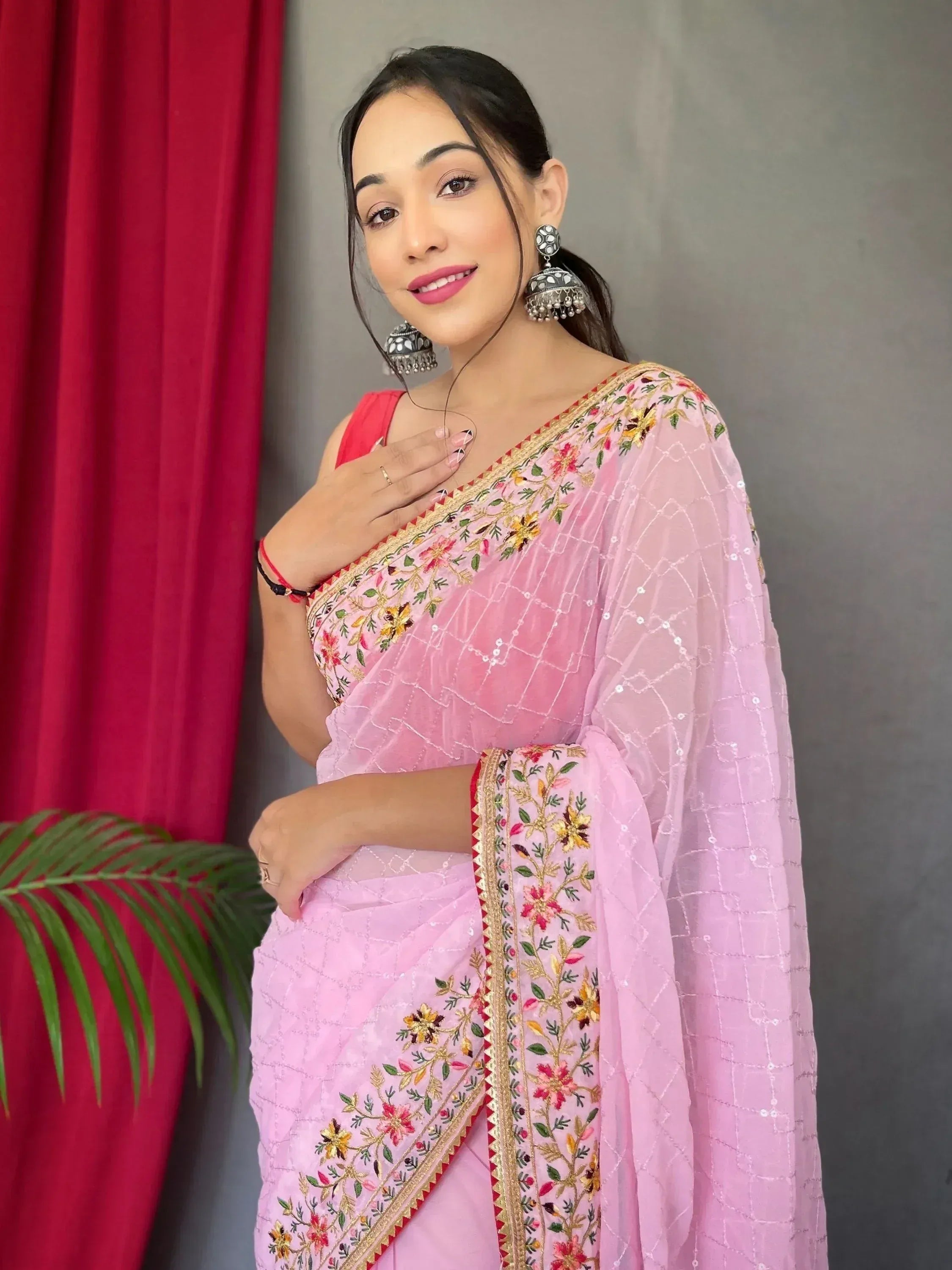 Pink embroidered saree with floral design, perfect for Indian ethnic wear occasions