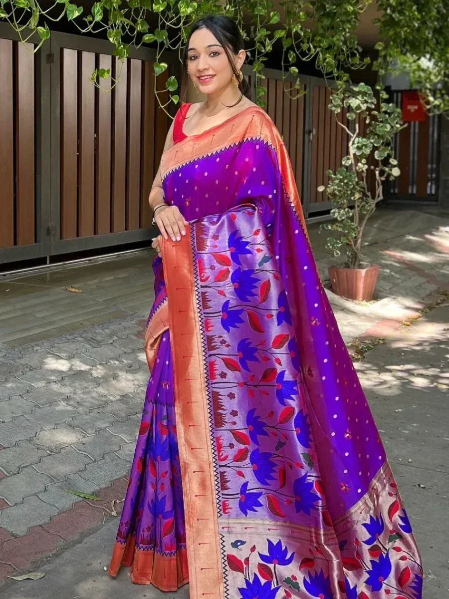 Woman in vibrant purple and orange floral saree, perfect for Indian ethnic occasions