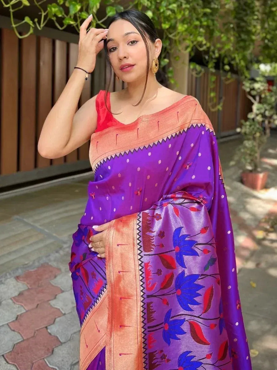 Purple floral saree with orange border, styled with red blouse for ethnic wear