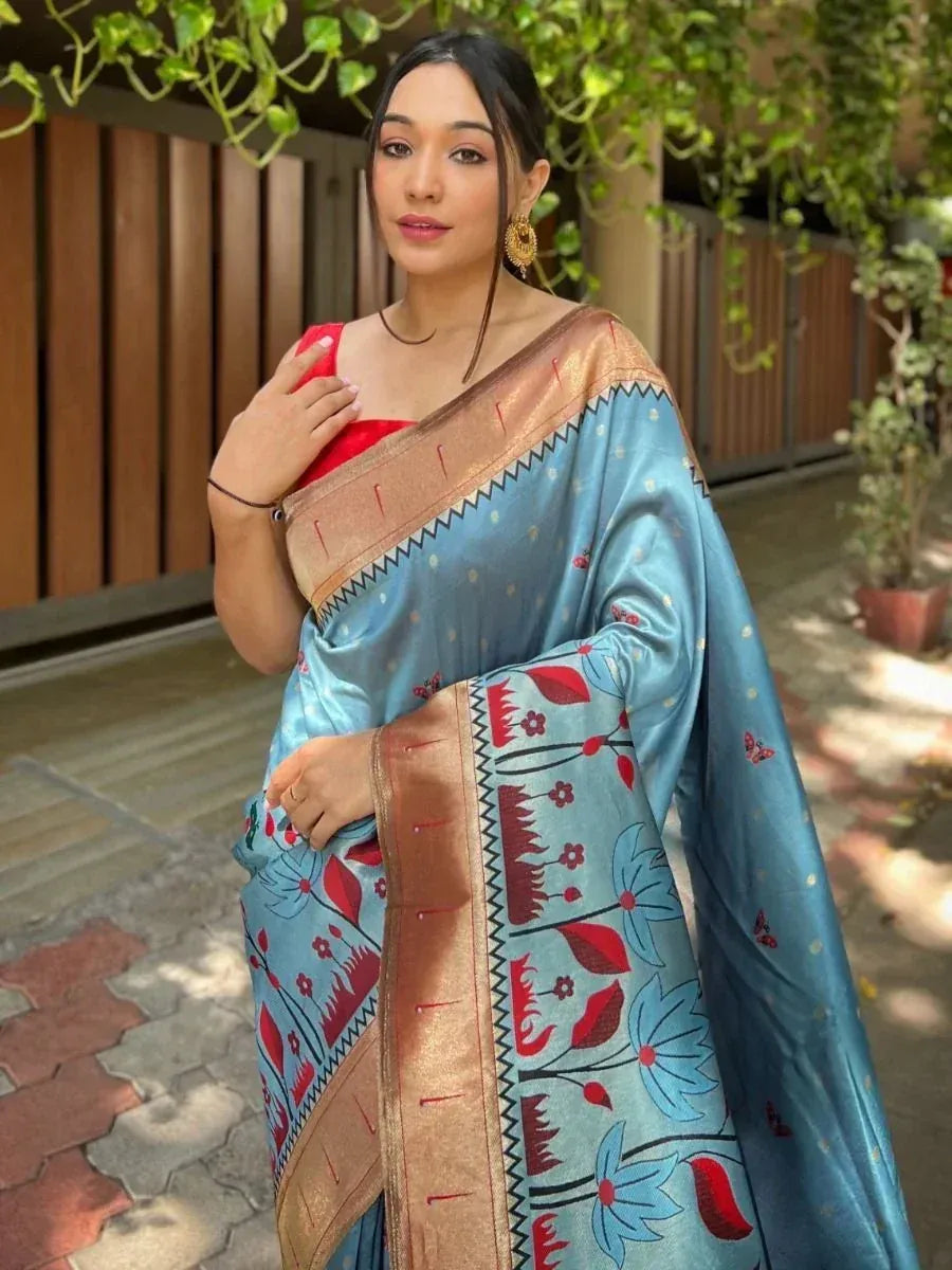 Blue floral saree with red blouse and gold border, perfect for Indian ethnic wear occasions