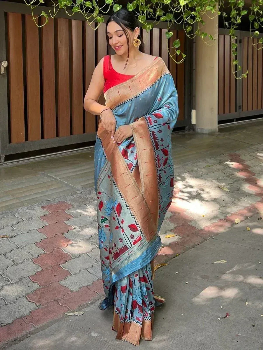 Woman in blue floral saree with red blouse, ethnic Indian wear for festive occasions