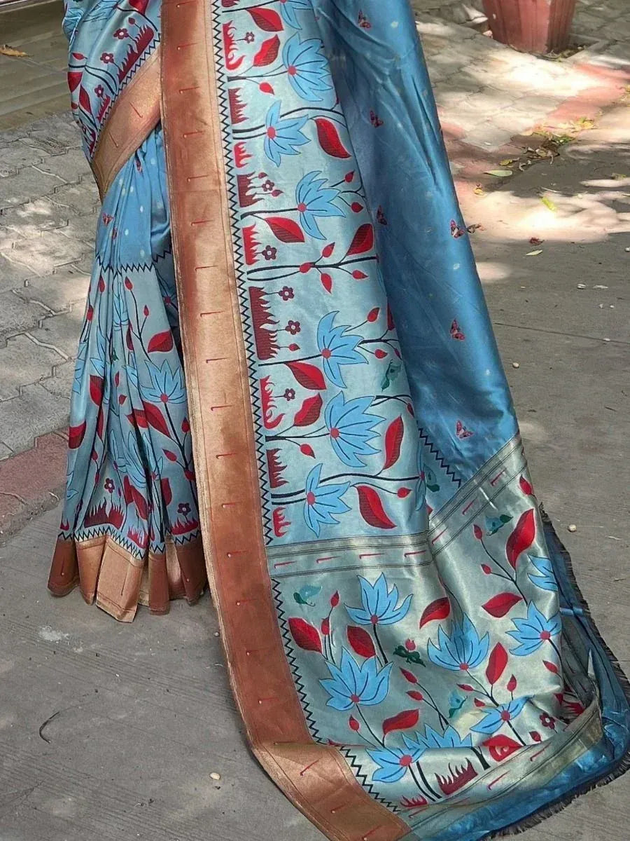 Blue floral print saree with red accents and golden border, ideal for ethnic wear occasions